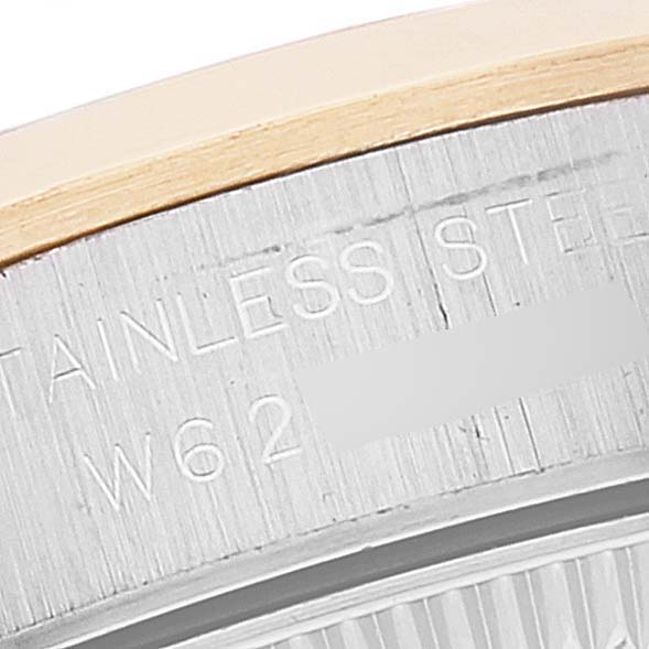 The image shows a close-up of the stainless steel case back of a Rolex Oyster Perpetual 67183 Women's Steel and Gold (two tone) Silver Dial 67183 Women's Steel and Gold (two tone) Silver Dial watch.