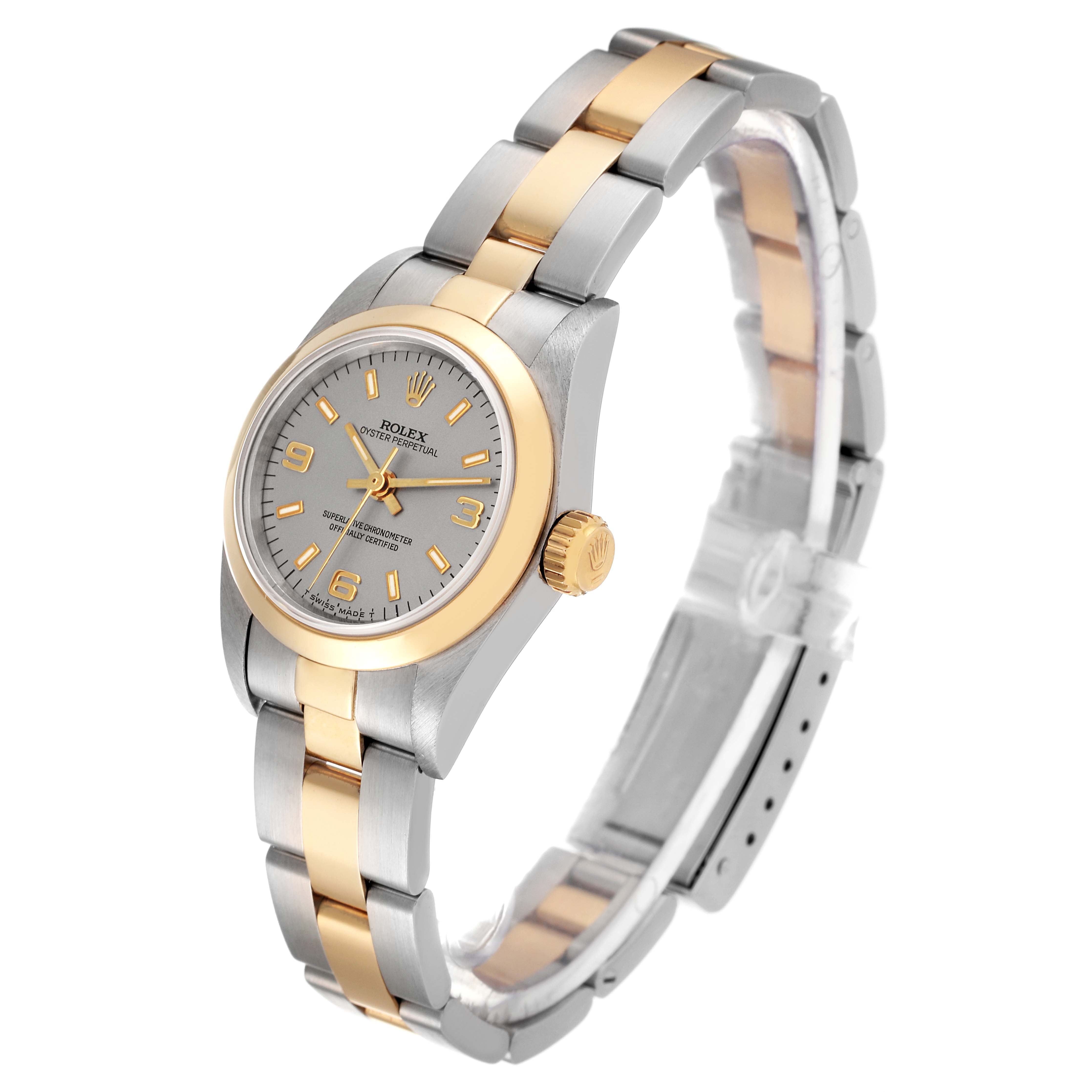The image shows a side view of a Rolex Oyster Perpetual 67183 Women's Steel and Gold (two tone) Silver Dial 67183 Women's Steel and Gold (two tone) Silver Dial watch, highlighting the band, crown, and face.