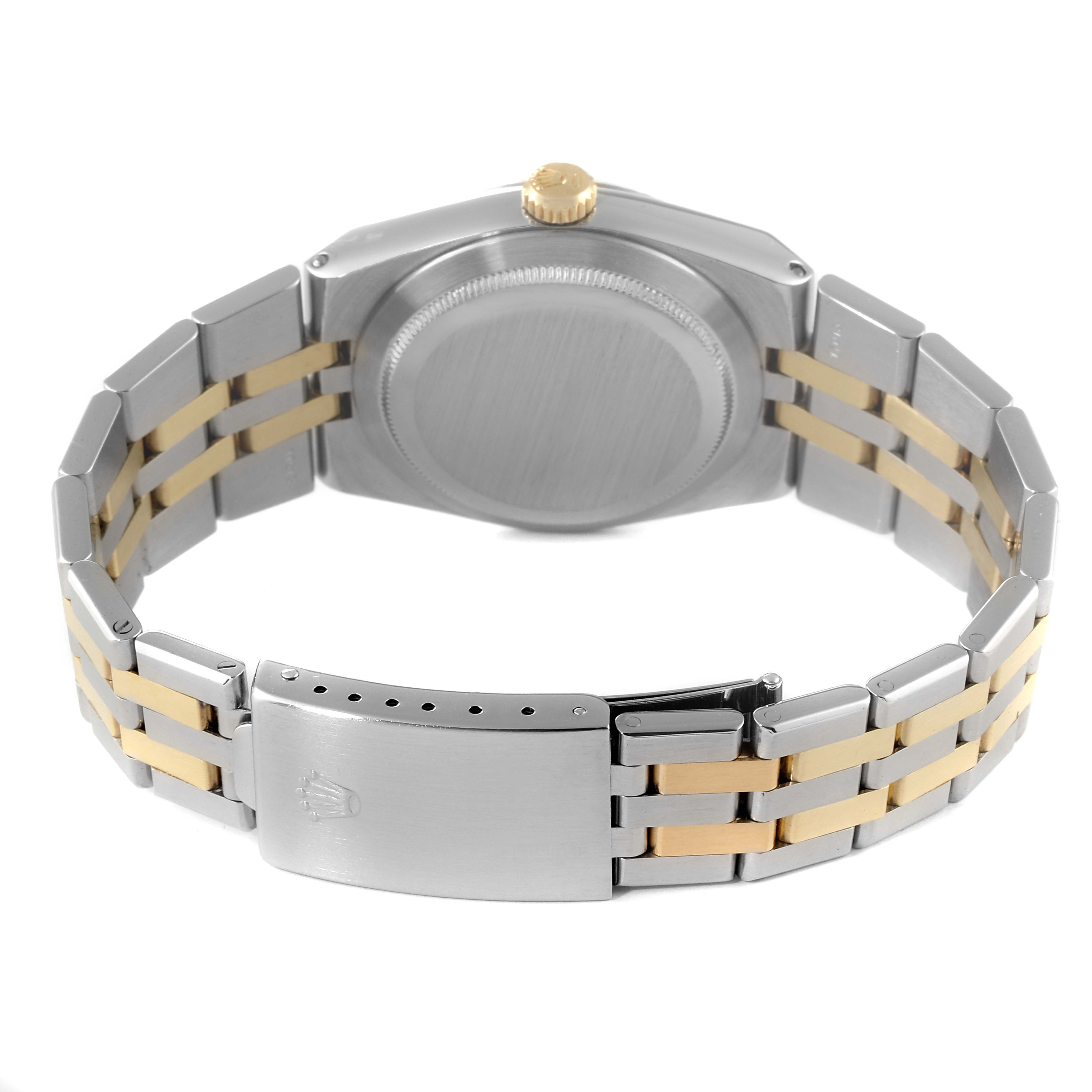 The image shows the back view of the Rolex Oysterquartz 17013 Men's Steel and Gold (two tone) White Dial 17013 Men's Steel and Gold (two tone) White Dial watch, highlighting the case back, crown, and bi-tone bracelet with a clasp.