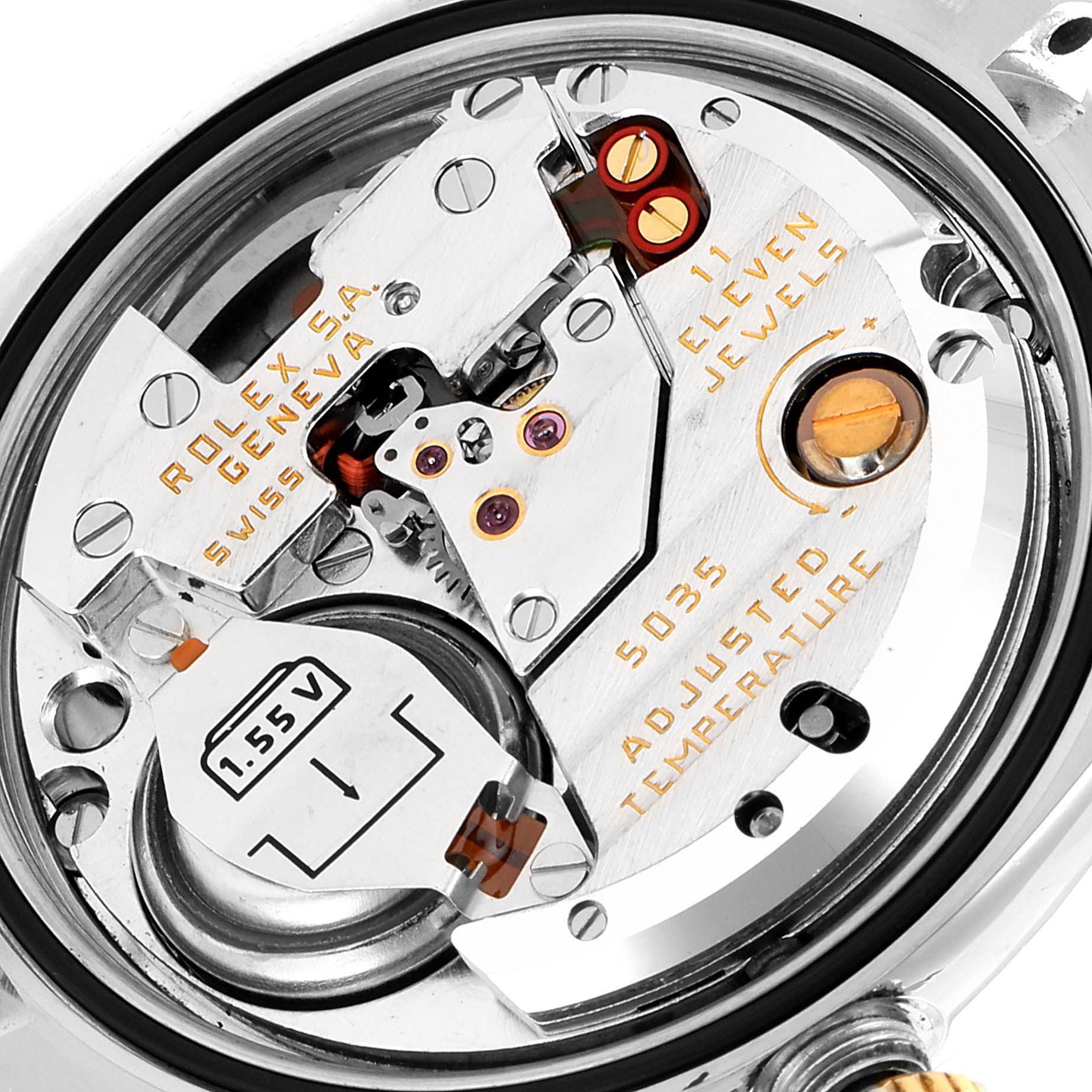 The image shows a close-up view of the movement and internal components of a Rolex Oysterquartz 17013 Men's Steel and Gold (two tone) Champagne Dial 17013 Men's Steel and Gold (two tone) Champagne Dial watch.