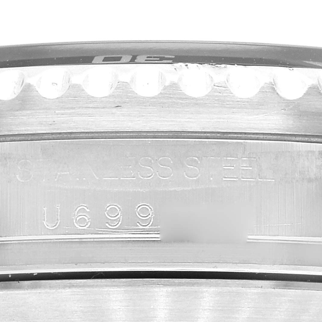 This image shows a close-up of the serial number and stainless steel text on the case back of a Rolex Sea-Dweller 16600 Men's Stainless Steel Black Dial 16600 Men's Stainless Steel Black Dial watch.