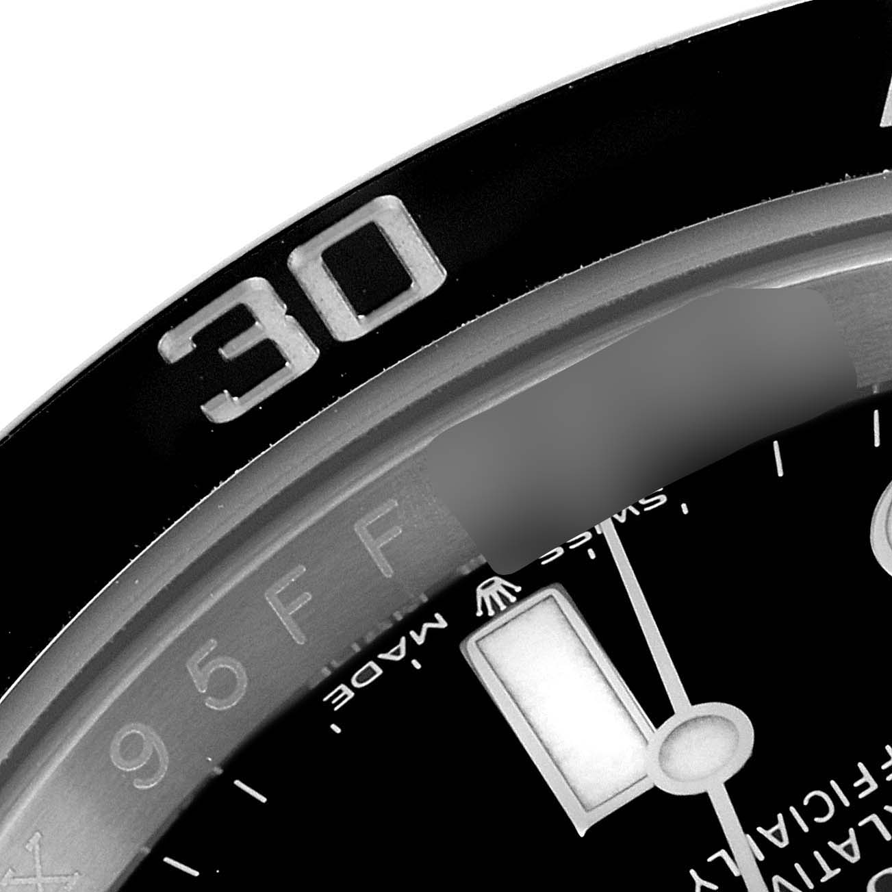 This image shows a close-up of the bezel, part of the dial, and the 
30
 minute marker of the Rolex Submariner 124060 Men
s Stainless Steel Black Dial 124060 Men
s Stainless Steel Black Dial watch.
