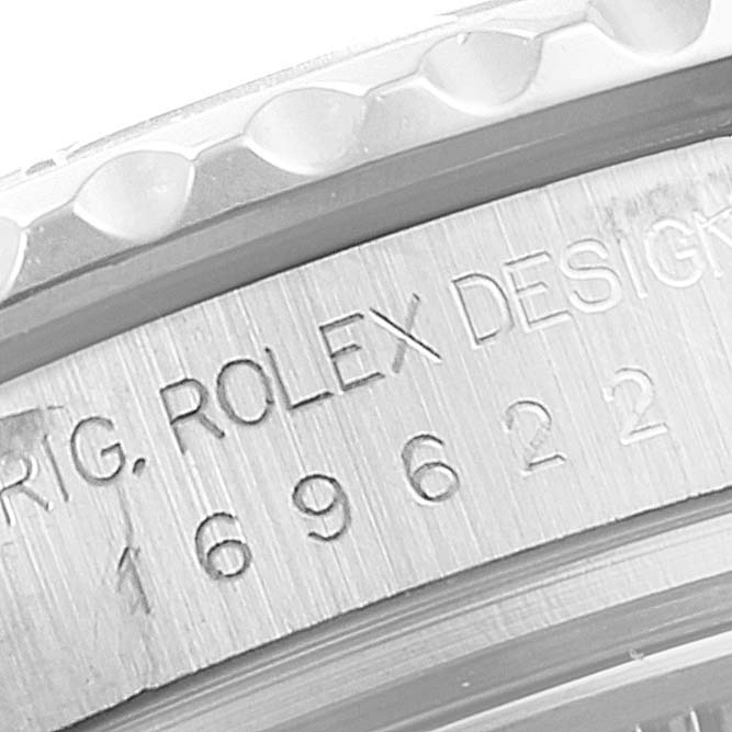 The image shows an engraved section of the bezel and case of a Rolex Yacht-Master 169622 Women
s Stainless Steel Silver Dial 169622 Women
s Stainless Steel Silver Dial watch.