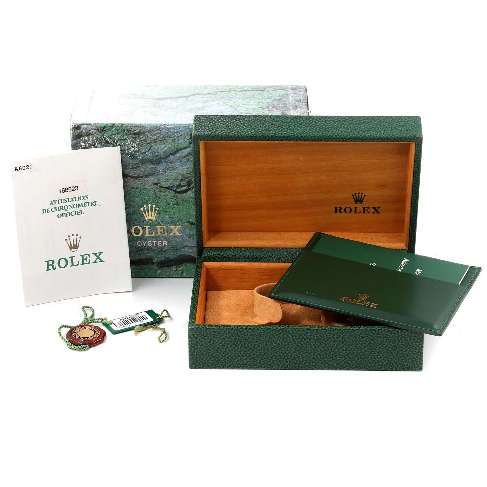The image shows a Rolex Yacht-Master 168623 Men
s Steel and Gold (two tone) Grey Dial 168623 Men
s Steel and Gold (two tone) Grey Dial watch box, its green outer box, manuals, a certification booklet, and a tag.