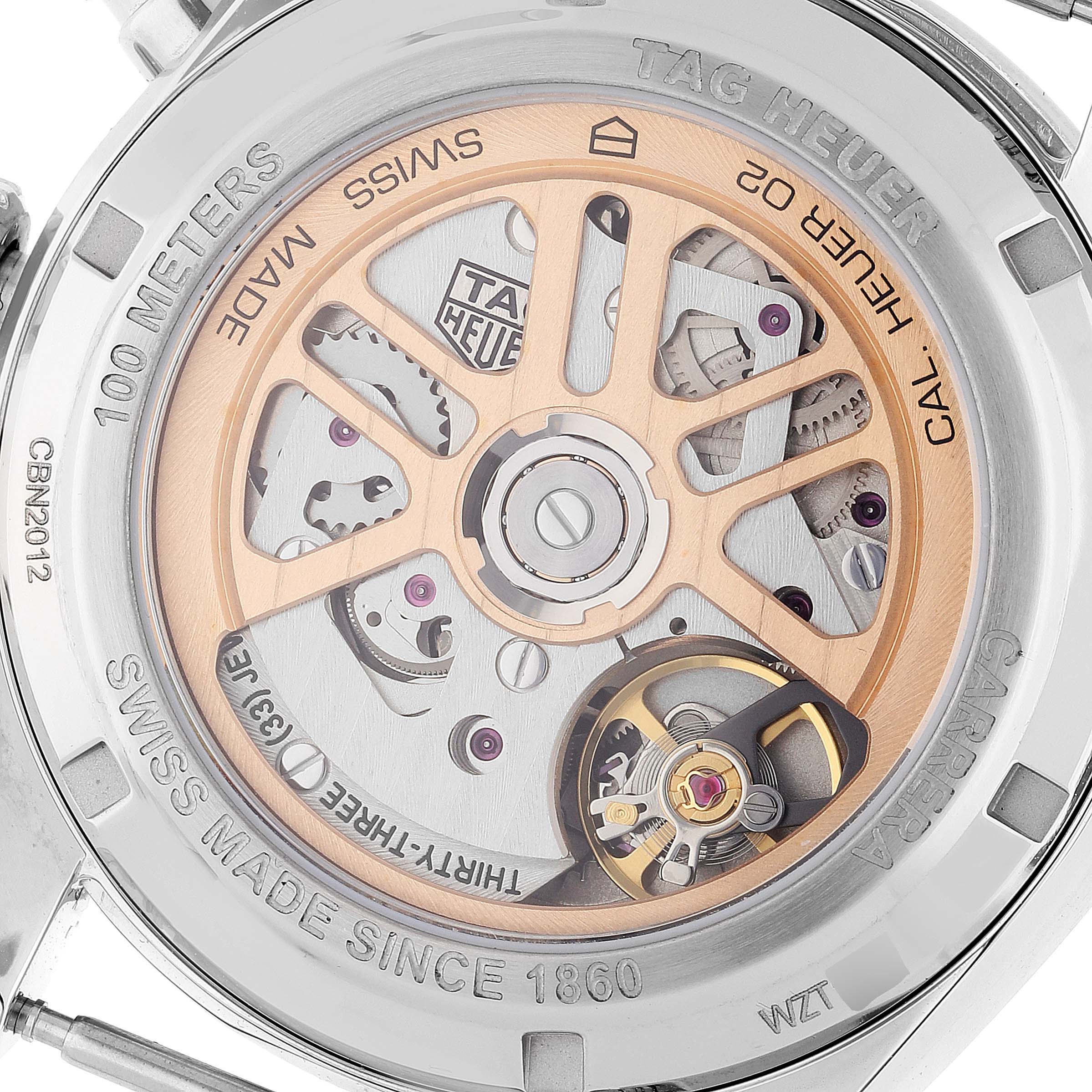 The image shows the back view of a Tag Heuer Carrera CBN2012.FC6483 Men's Stainless Steel Grey Dial CBN2012.FC6483 Men's Stainless Steel Grey Dial watch, highlighting its Swiss-made movement and intricate mechanical parts.