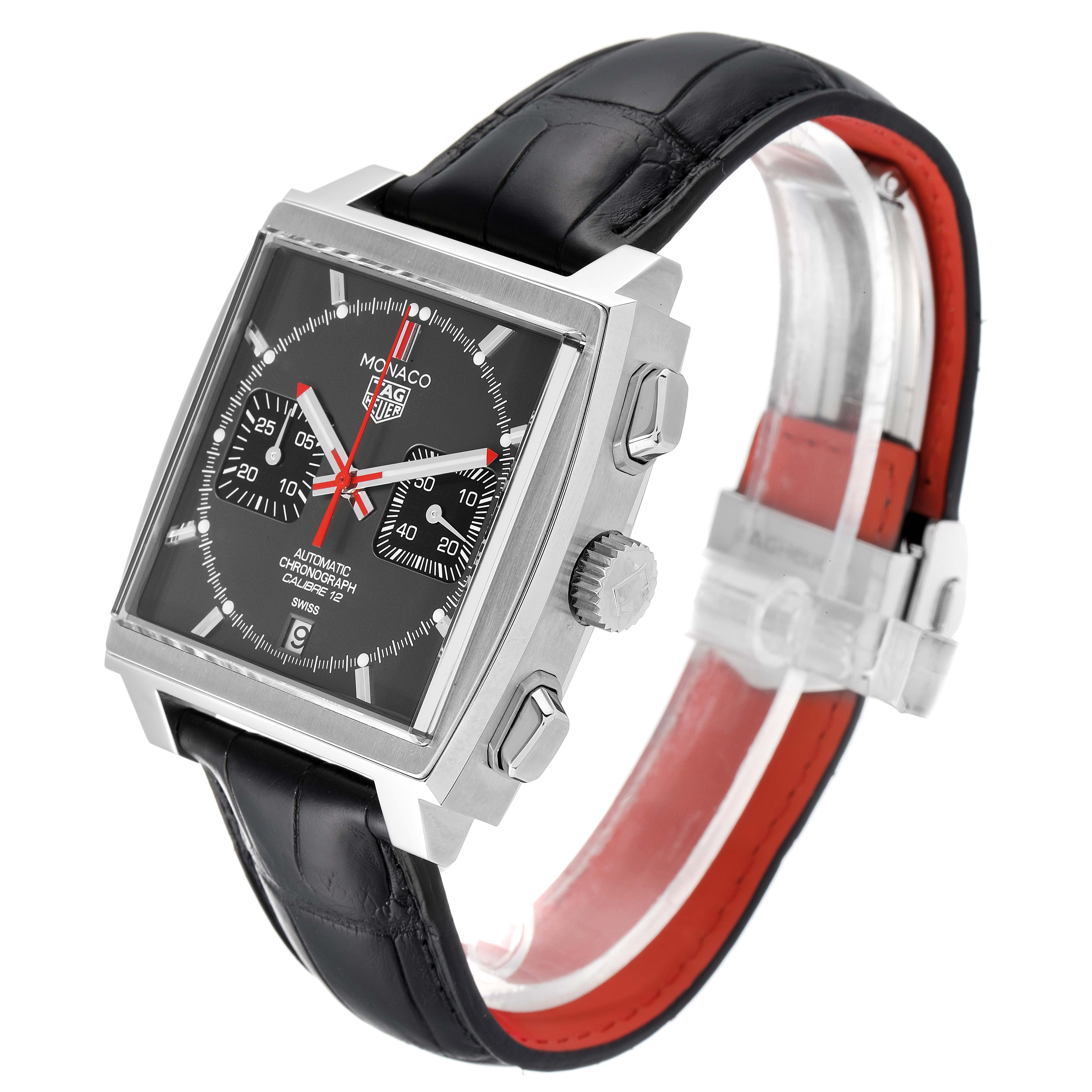 This Tag Heuer Monaco watch is shown at an oblique angle, highlighting the square case, crown, pushers, and black leather strap.