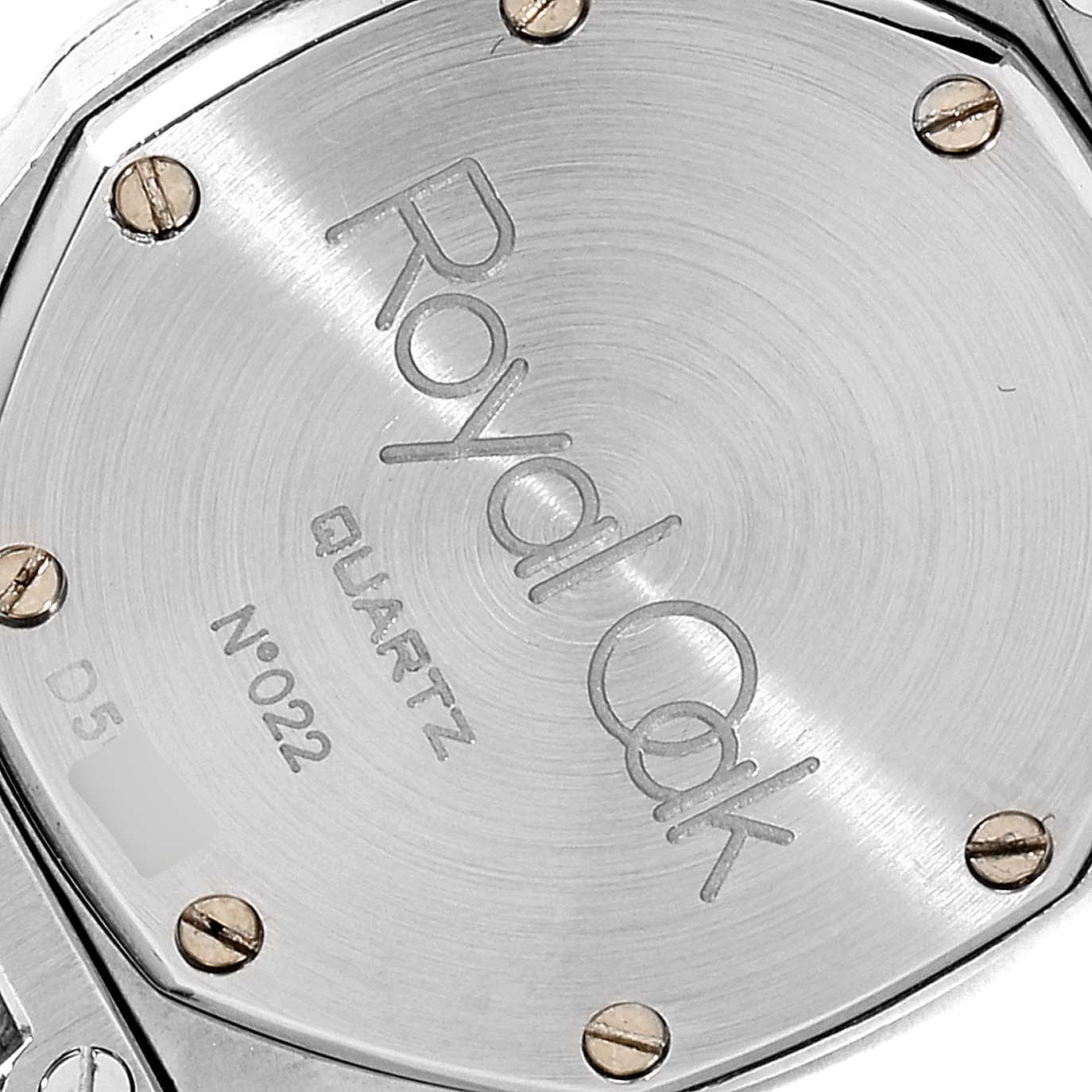 This image shows the back case of an Audemars Piguet Royal Oak  Women's Steel and Gold (two tone) Grey Dial  Women's Steel and Gold (two tone) Grey Dial watch, displaying the screw heads and engraving details.