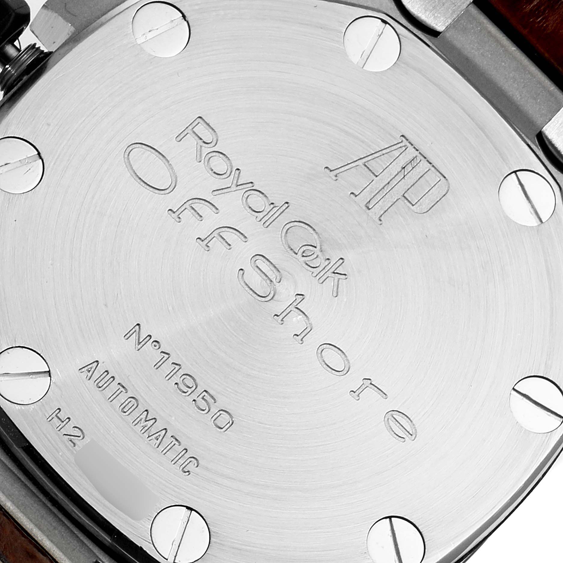 The image shows the case back of an Audemars Piguet Royal Oak Offshore 26170ST.OO.D091CR.01 Men's Stainless Steel Silver Dial 26170ST.OO.D091CR.01 Men's Stainless Steel Silver Dial model, featuring engraved text and screws.