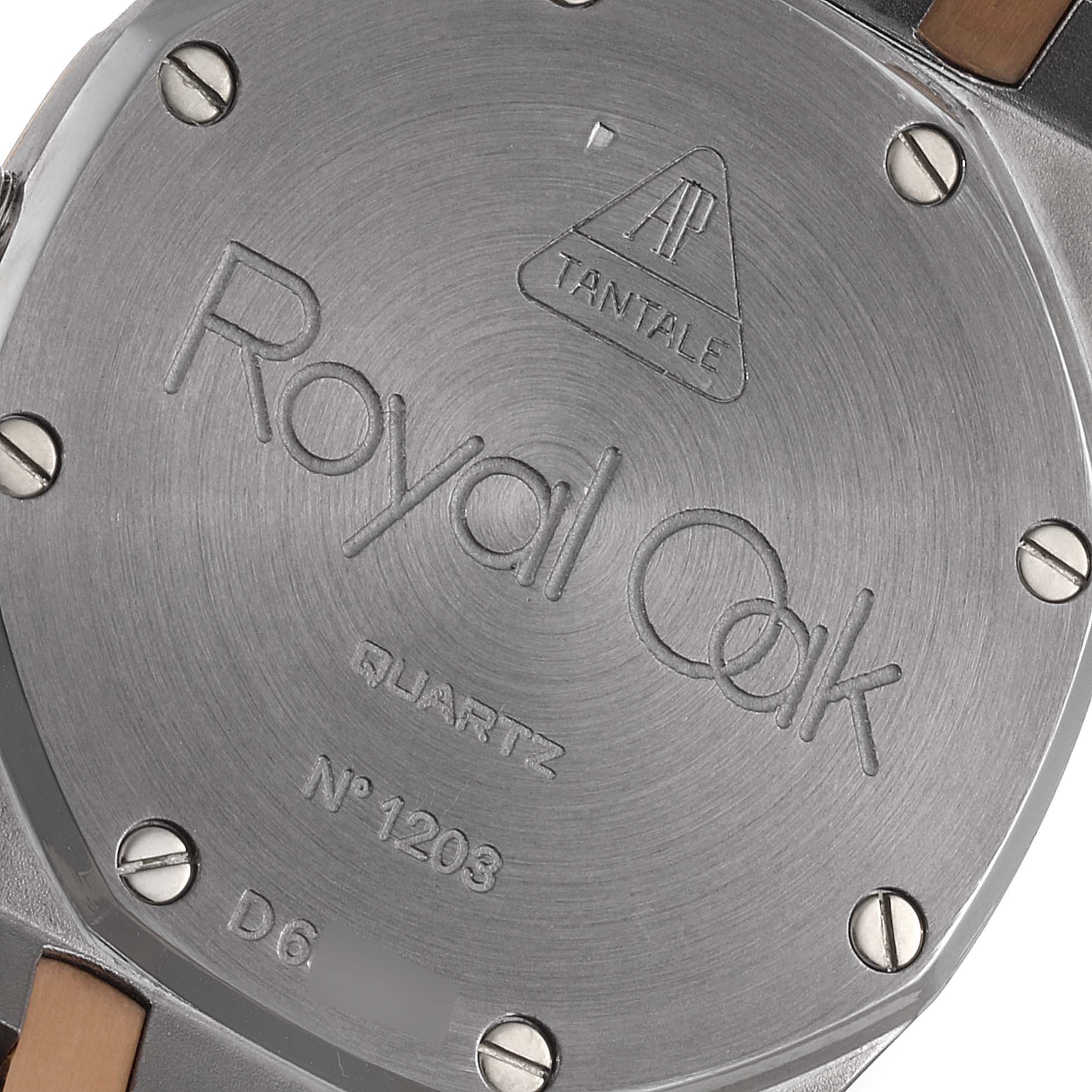 The image shows the case back of an Audemars Piguet Royal Oak 56175TR-OO-0789TR-01 Men's Steel and Gold (two tone) Black Dial 56175TR-OO-0789TR-01 Men's Steel and Gold (two tone) Black Dial Quartz model, highlighting the engravings and screws.