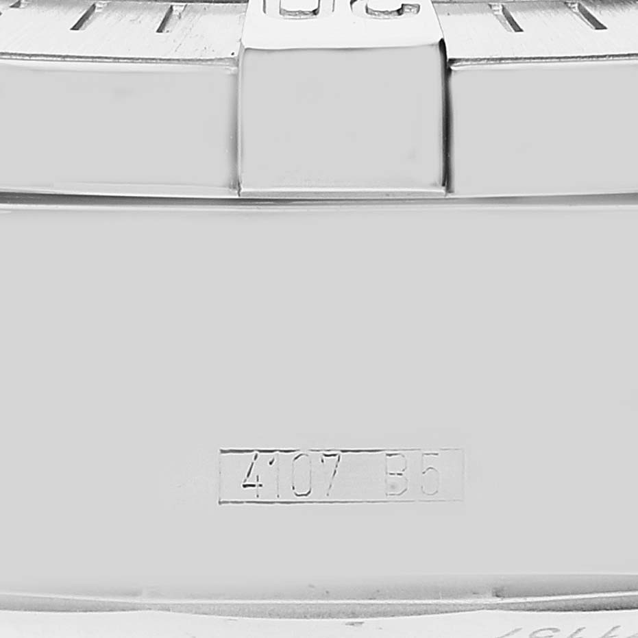 This close-up image of the Breitling Superocean A13340 Men's Stainless Steel Beige Dial A13340 Men's Stainless Steel Beige Dial watch shows part of the bezel and case with engraved markings.