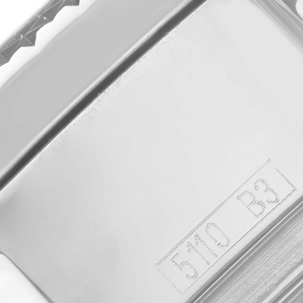 This image shows a close-up of the back casing of a Bentley Breitling watch, featuring engraved markings.