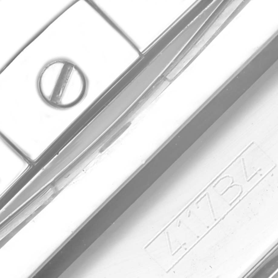 The image shows a close-up of the band or clasp of a Breitling Chronomat AB0115 Men's Stainless Steel Blue Dial AB0115 Men's Stainless Steel Blue Dial, highlighting a screw and engraved detail.