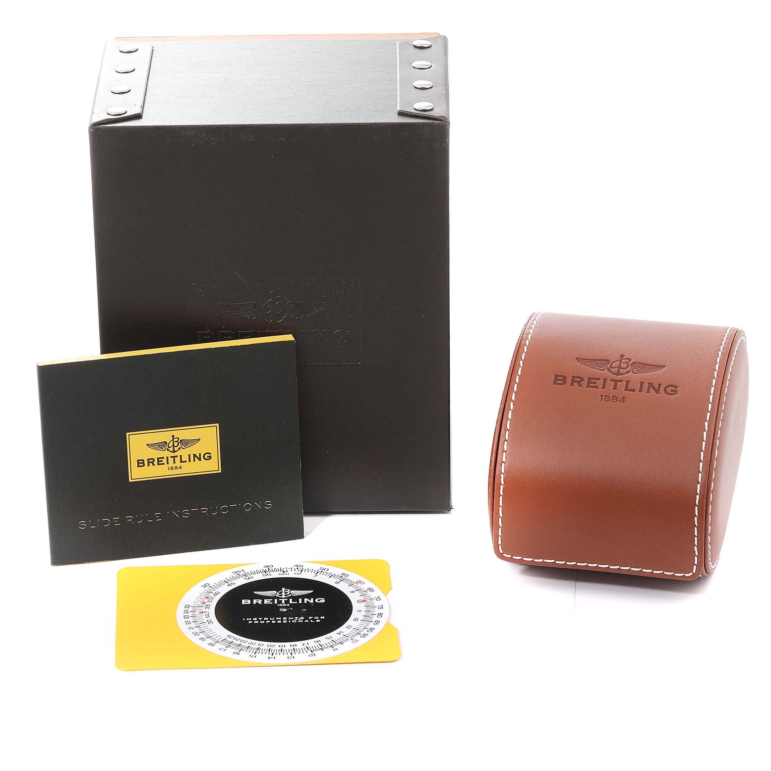 The image shows packaging parts for a Breitling Navitimer AB0123 Men's Stainless Steel Silver Dial AB0123 Men's Stainless Steel Silver Dial, including a black box, instruction booklet, slide rule, and brown leather case.