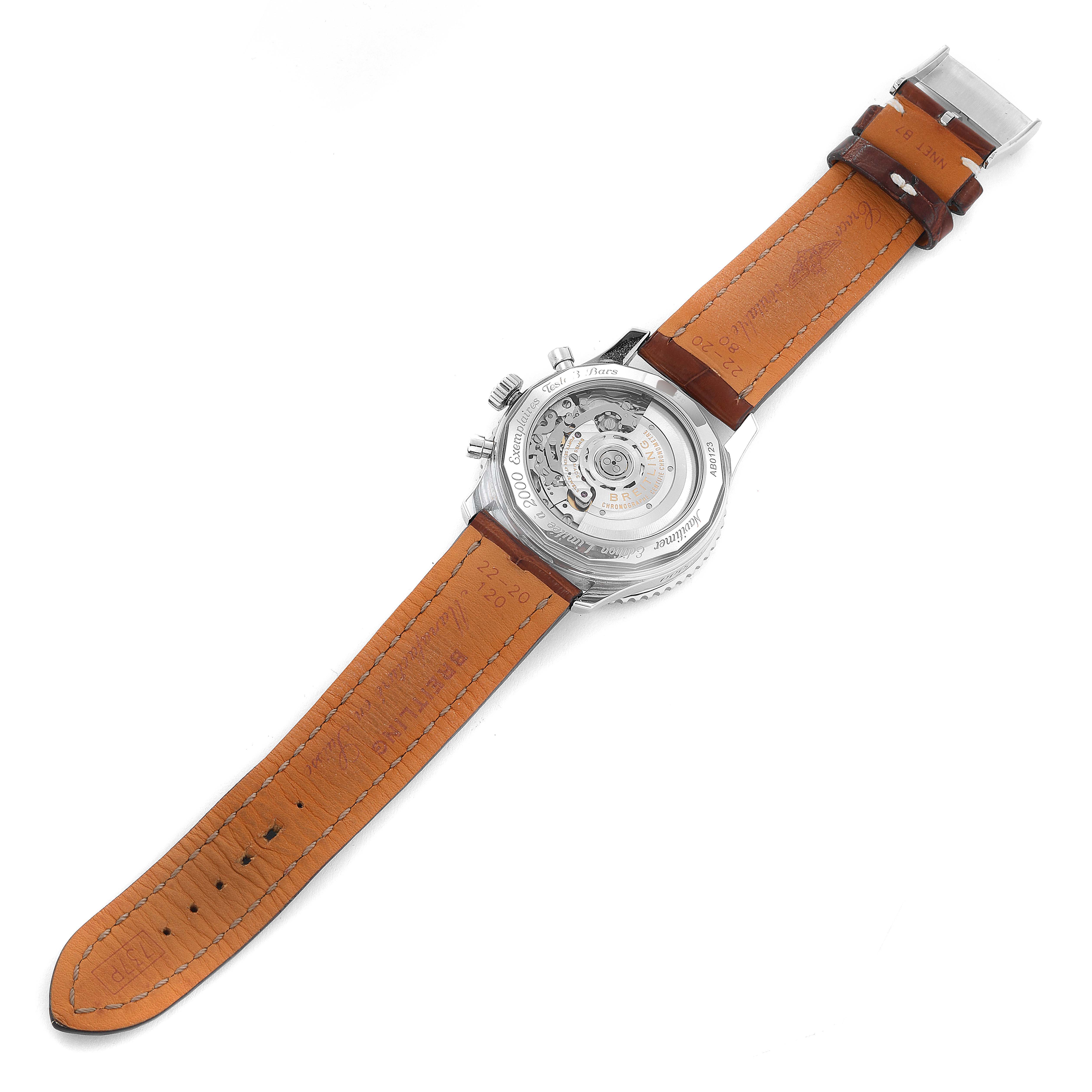 The image shows the back and strap of a Breitling Navitimer AB0123 Men's Stainless Steel Silver Dial AB0123 Men's Stainless Steel Silver Dial watch, highlighting its mechanical movement and leather strap.