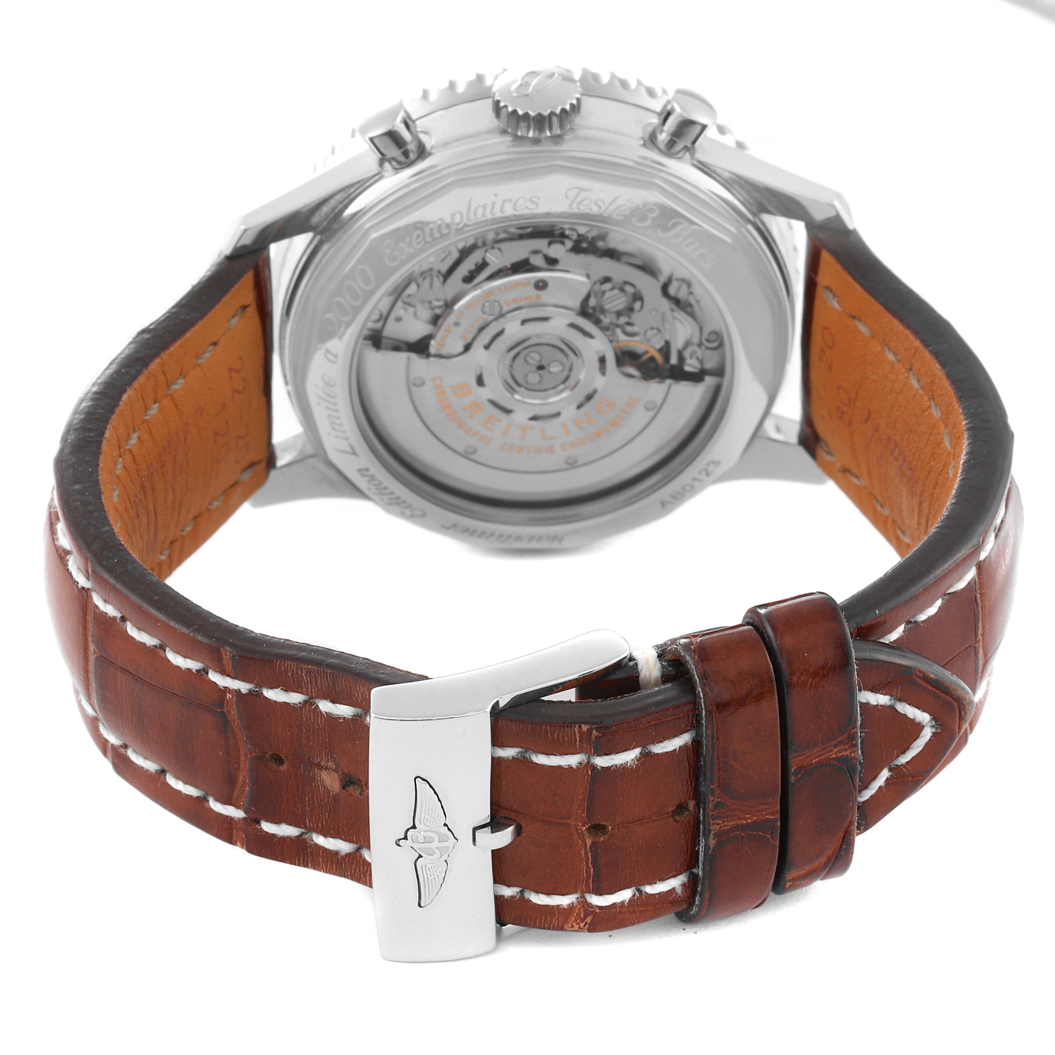 The image shows the back view of the Breitling Navitimer AB0123 Men's Stainless Steel Silver Dial AB0123 Men's Stainless Steel Silver Dial watch including its brown leather strap and exposed automatic movement.