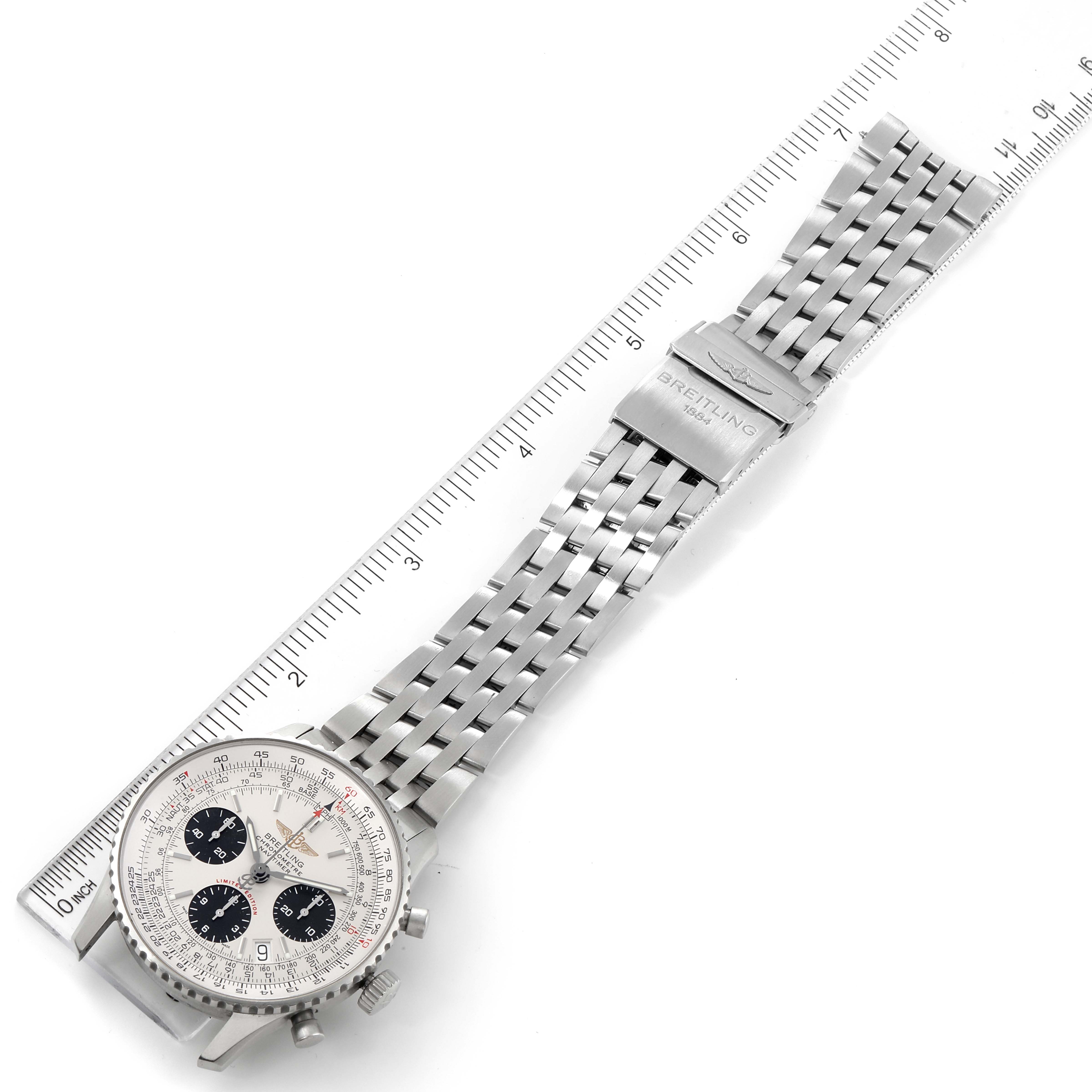 The image shows a Breitling Navitimer A23322 Men's Stainless Steel Silver Dial A23322 Men's Stainless Steel Silver Dial watch laid flat, displaying its dial, stainless steel bracelet, clasp, and pushers, alongside a ruler.