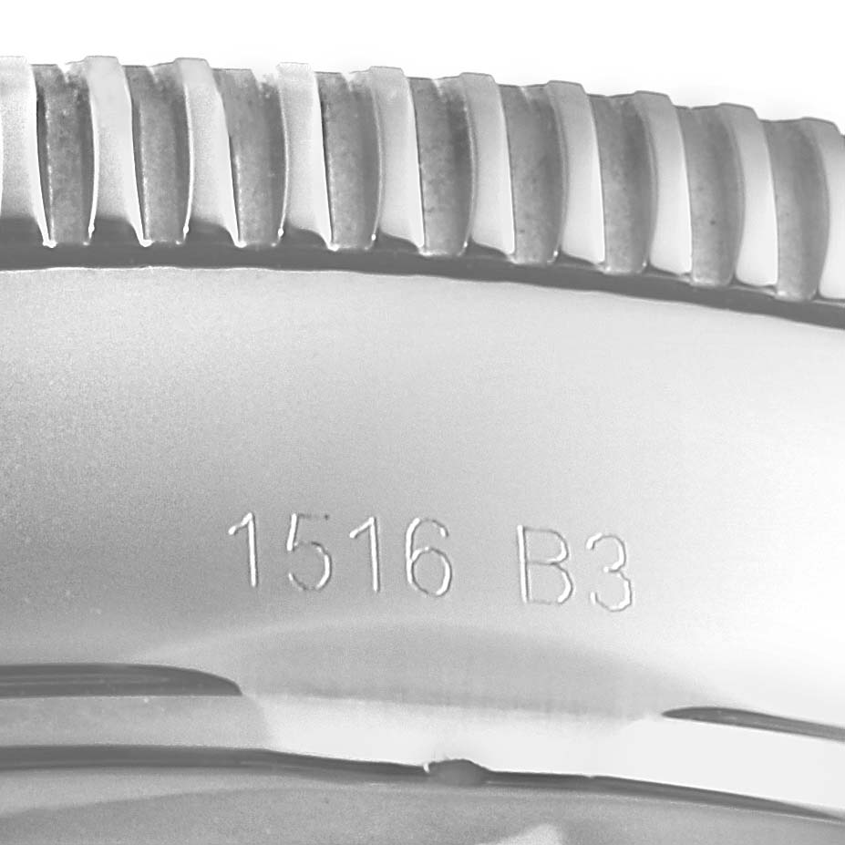 This image shows a close-up of the side of the bezel of a Breitling Superocean A13320 Men's Stainless Steel Blue Dial A13320 Men's Stainless Steel Blue Dial watch with visible engravings.