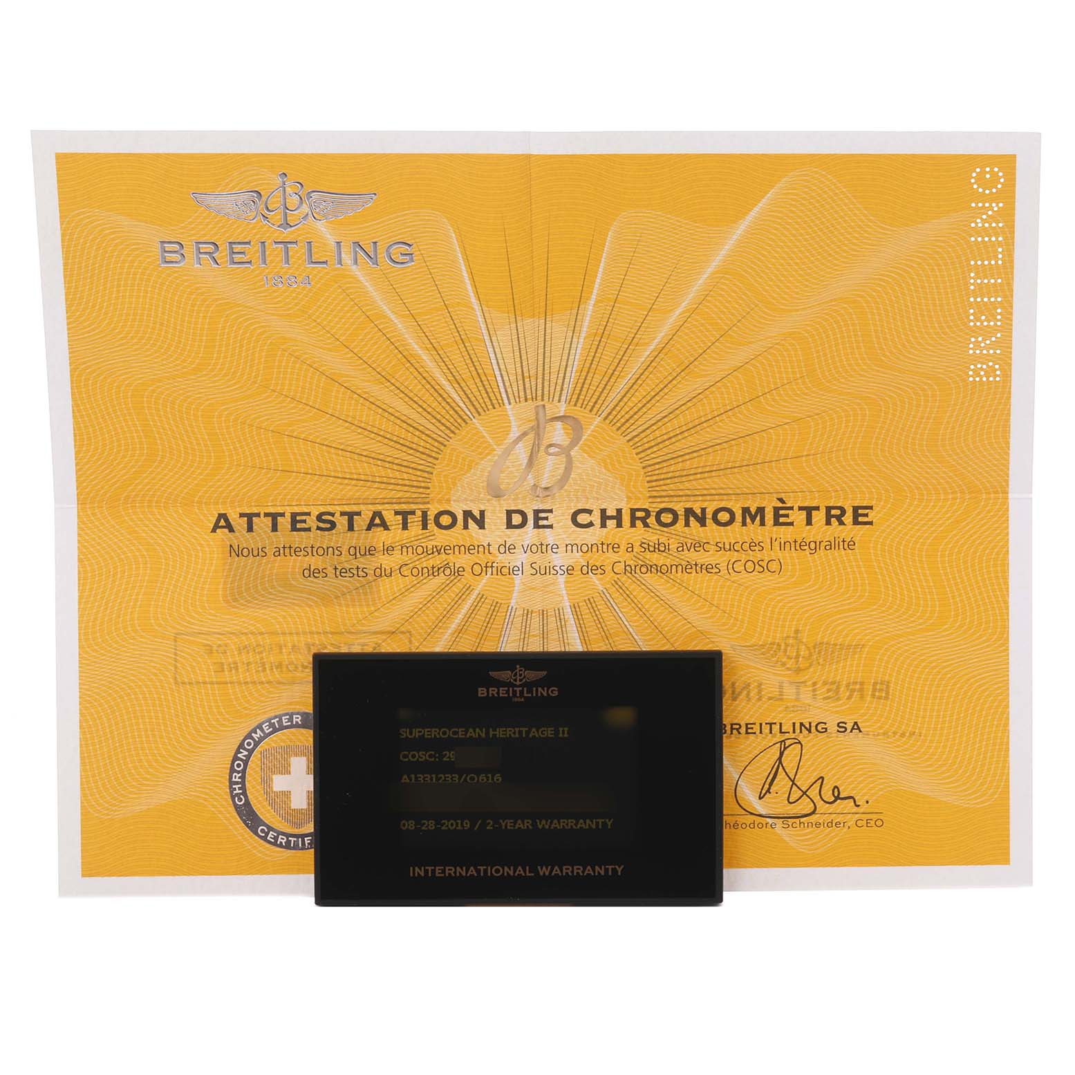 The image shows the warranty card and COSC certification for the Breitling Superocean A1331233/Q616 Men's Stainless Steel Brown Dial A1331233/Q616 Men's Stainless Steel Brown Dial model.