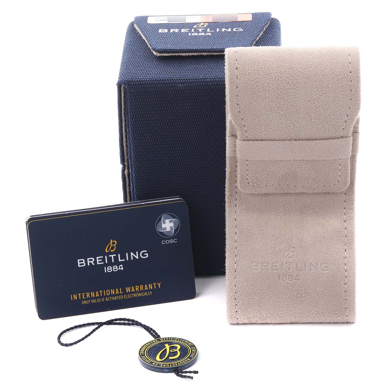 The image shows accessories for the Breitling Superocean U13313 Men's Steel and Gold (two tone) Black Dial U13313 Men's Steel and Gold (two tone) Black Dial watch, including a box, pouch, warranty card, and tag, viewed from the front.