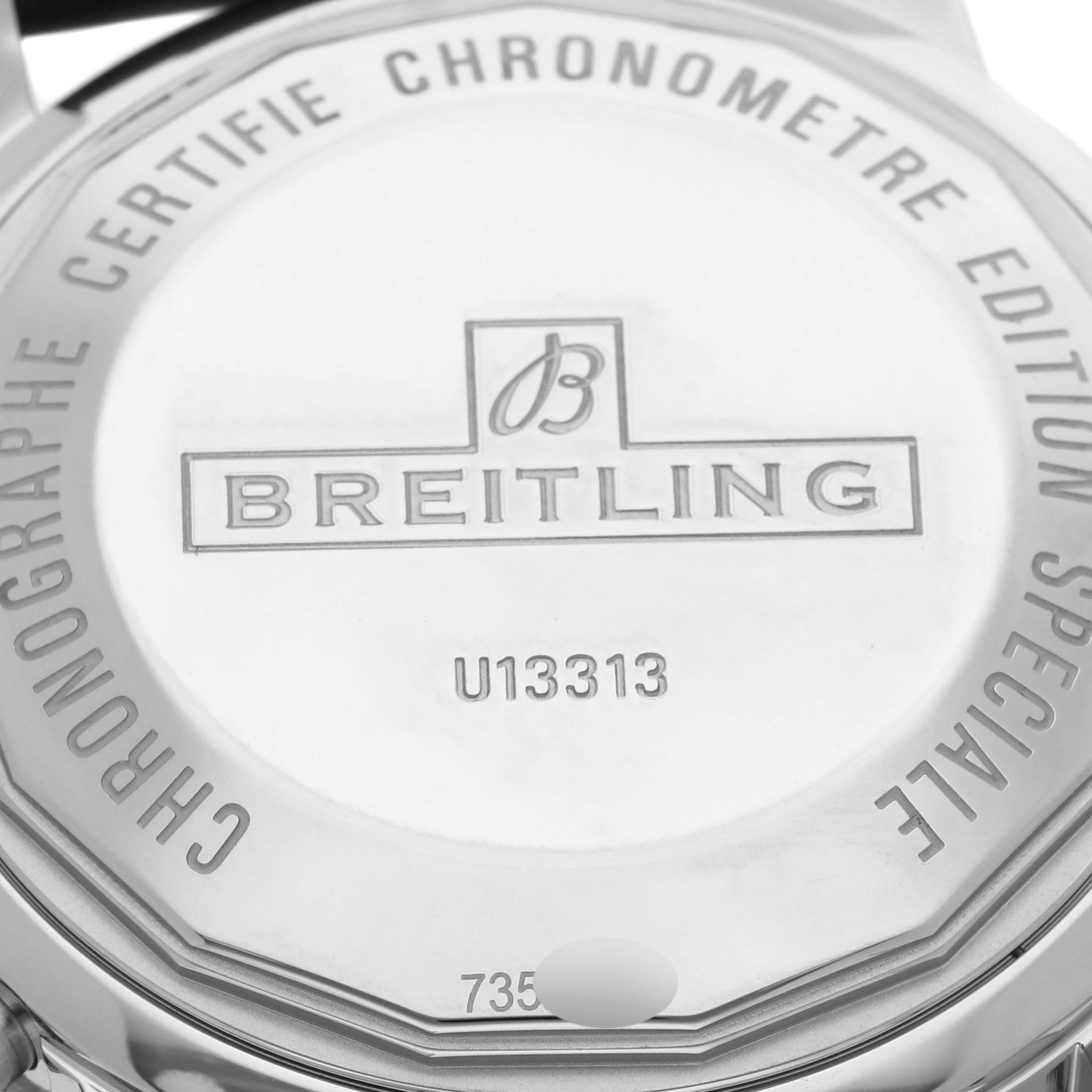 The image shows the back case of a Breitling Superocean U13313 Men's Steel and Gold (two tone) Black Dial U13313 Men's Steel and Gold (two tone) Black Dial watch with engraved details.