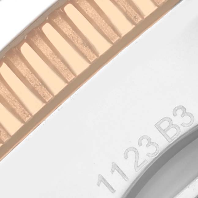 This image shows a close-up of the side and part of the bezel of the Breitling Superocean U13313 Men's Steel and Gold (two tone) Black Dial U13313 Men's Steel and Gold (two tone) Black Dial watch, highlighting its textured edge.