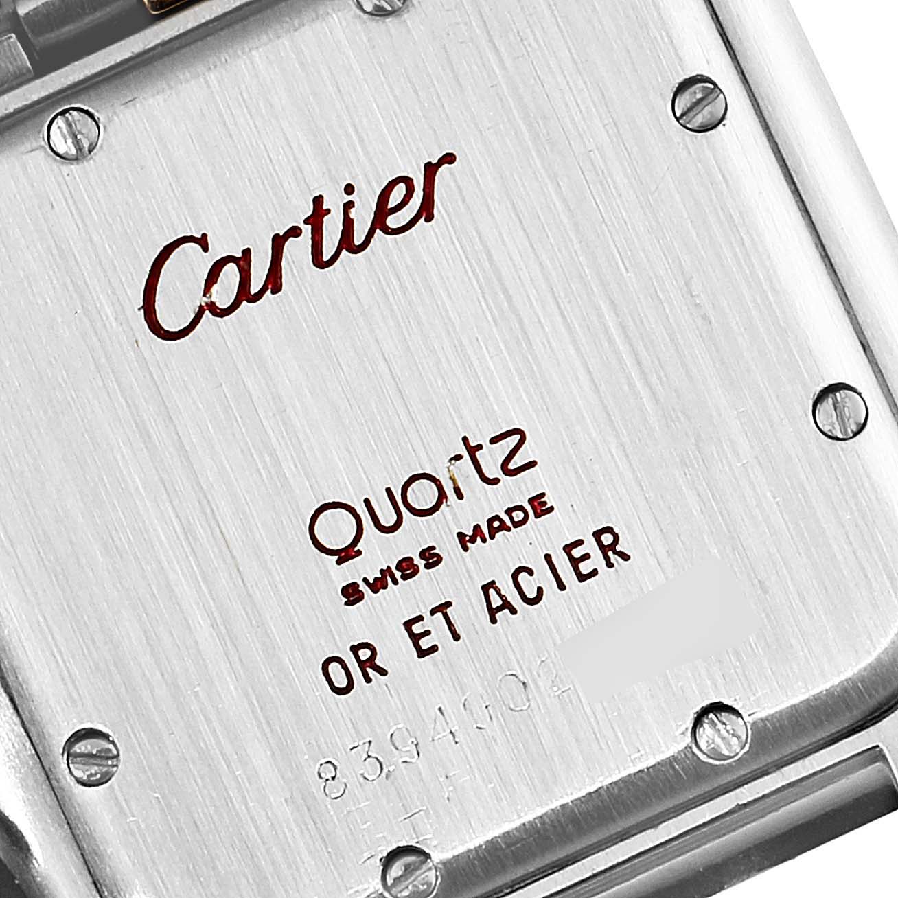 The image shows the case back of a Cartier Panthere W25028B5 Women
s Steel and Gold (two tone) Silver Dial W25028B5 Women
s Steel and Gold (two tone) Silver Dial watch with visible screws and inscriptions detailing the model and material.