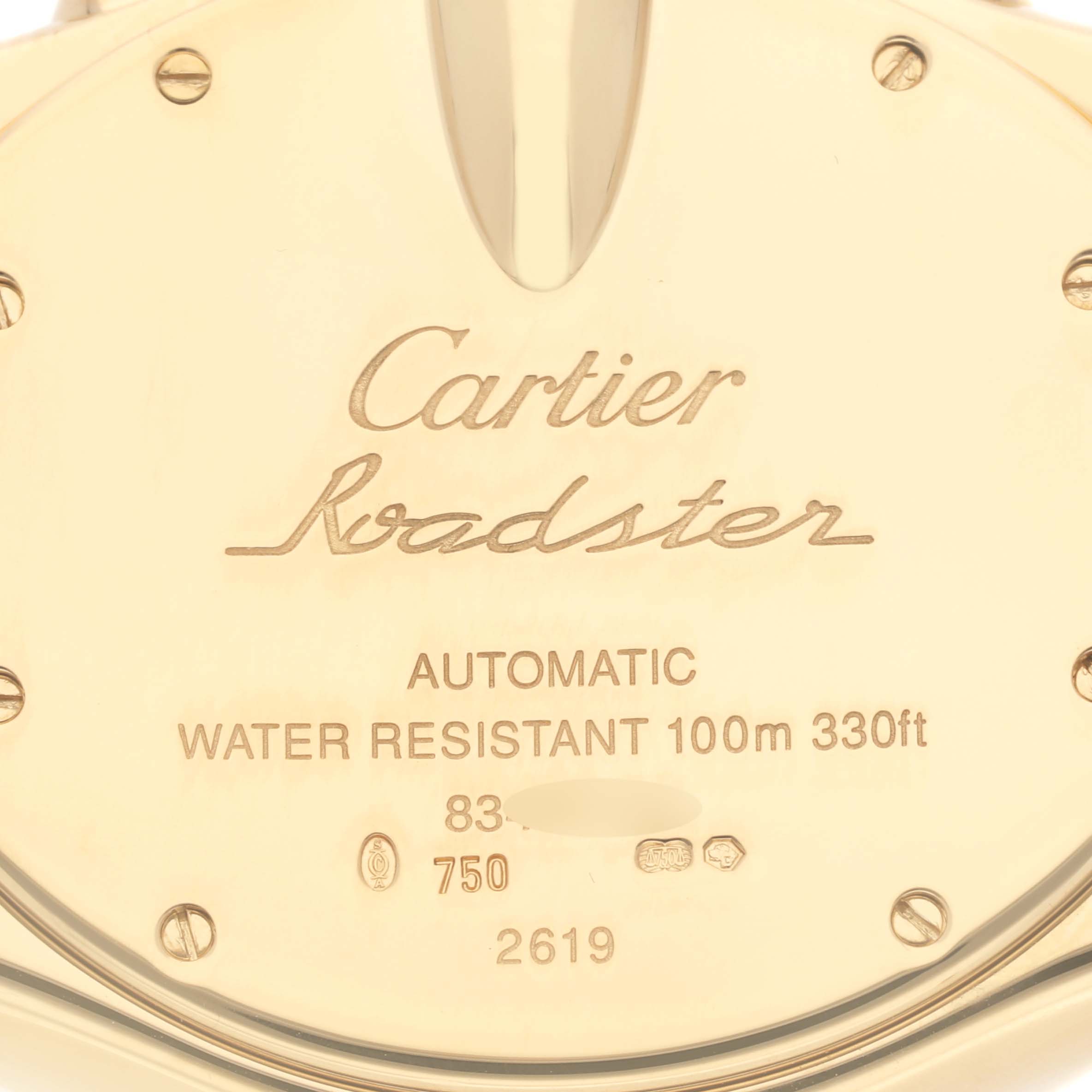 This image shows the back case of a Cartier Roadster W62021Y3 Men's Yellow Gold Silver Dial W62021Y3 Men's Yellow Gold Silver Dial watch, highlighting inscriptions and water resistance details.