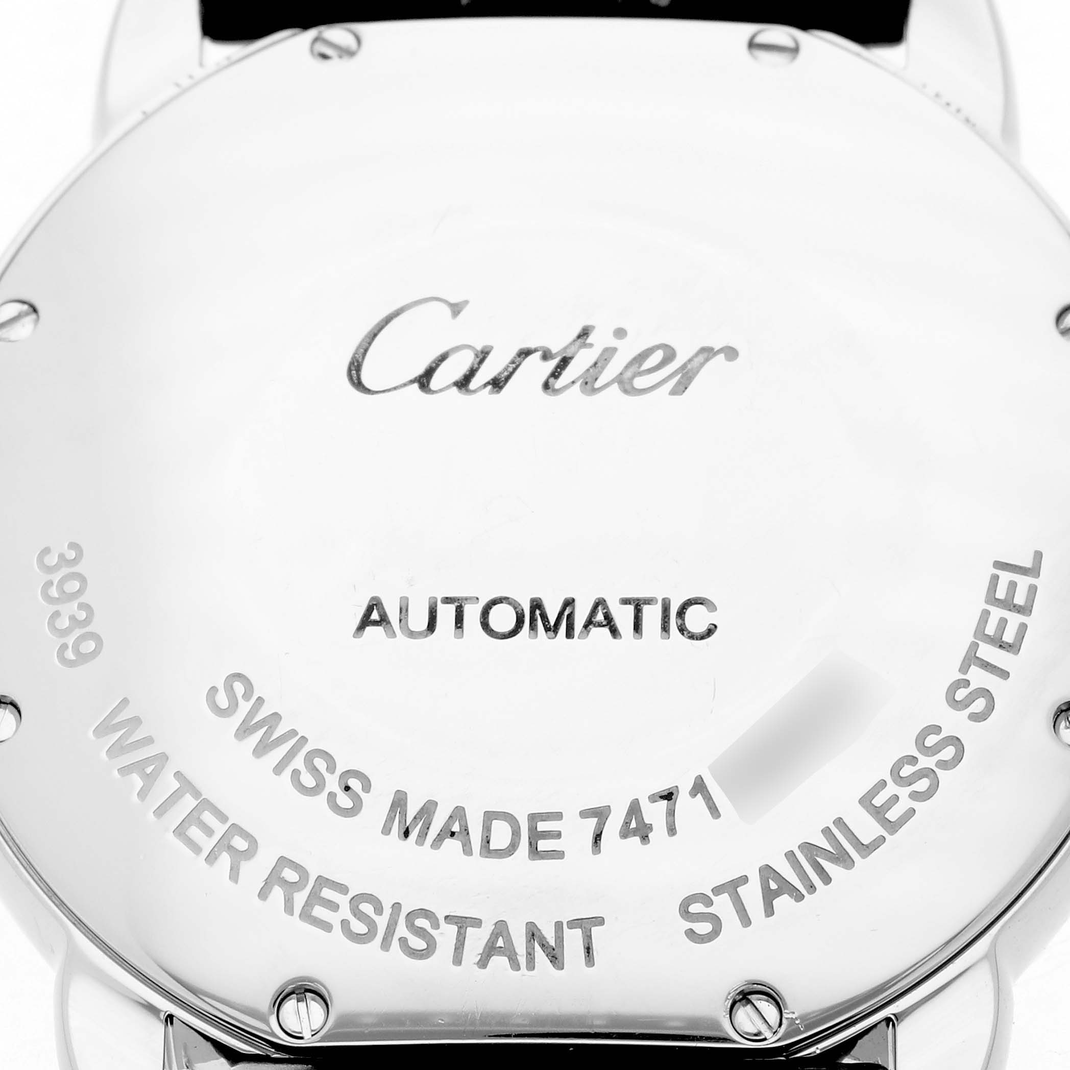 The image shows the back of a Cartier Ronde WSRN0013 Men's Stainless Steel Silver Dial WSRN0013 Men's Stainless Steel Silver Dial watch, displaying engravings about specifications and materials.