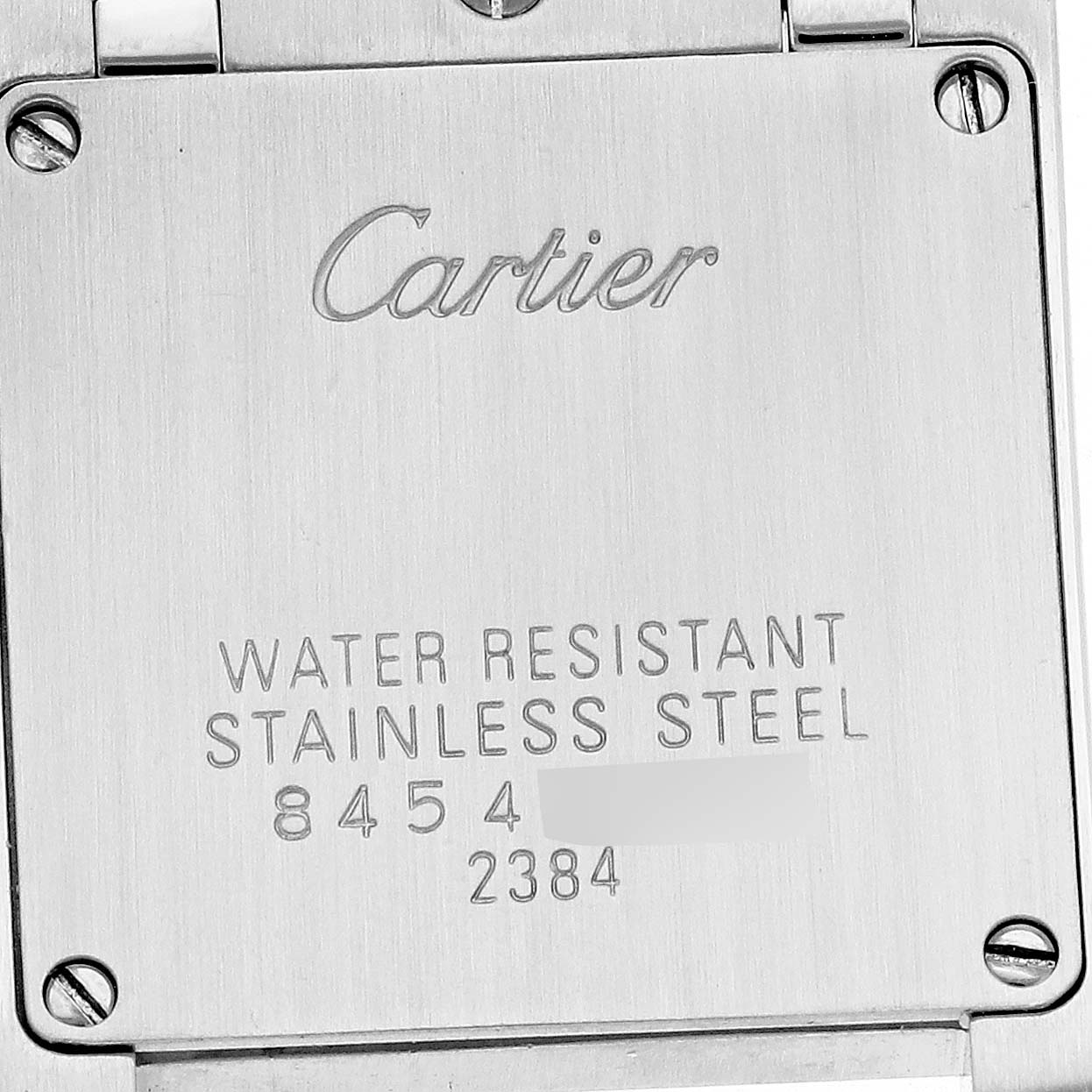 The image shows the back of a Cartier Tank Francaise W51008Q3 Women's Stainless Steel Silver Dial watch, highlighting its stainless steel case and water resistance details.