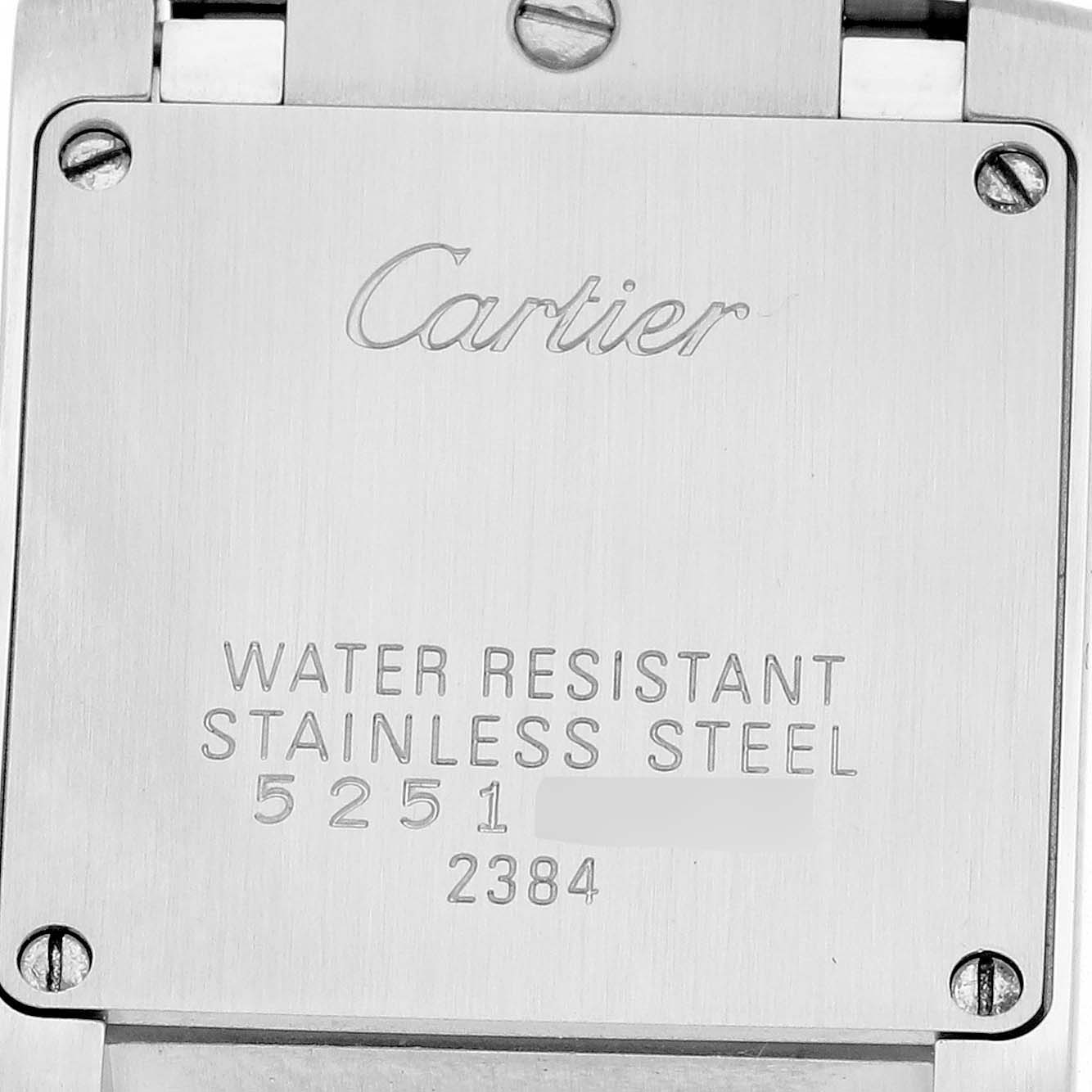 The image shows the back of a Cartier Tank Française, highlighting its water-resistant stainless steel case.