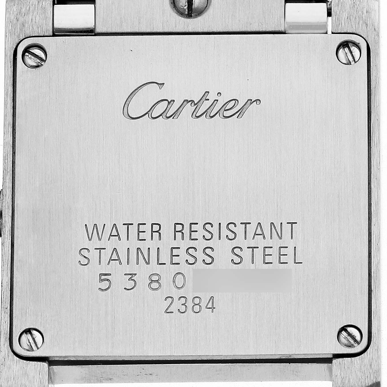 The image shows the back case of a Cartier Tank Francaise W51007Q4 Women's Steel and Gold (two tone) Silver Dial W51007Q4 Women's Steel and Gold (two tone) Silver Dial, featuring engraved text about the material and water resistance.