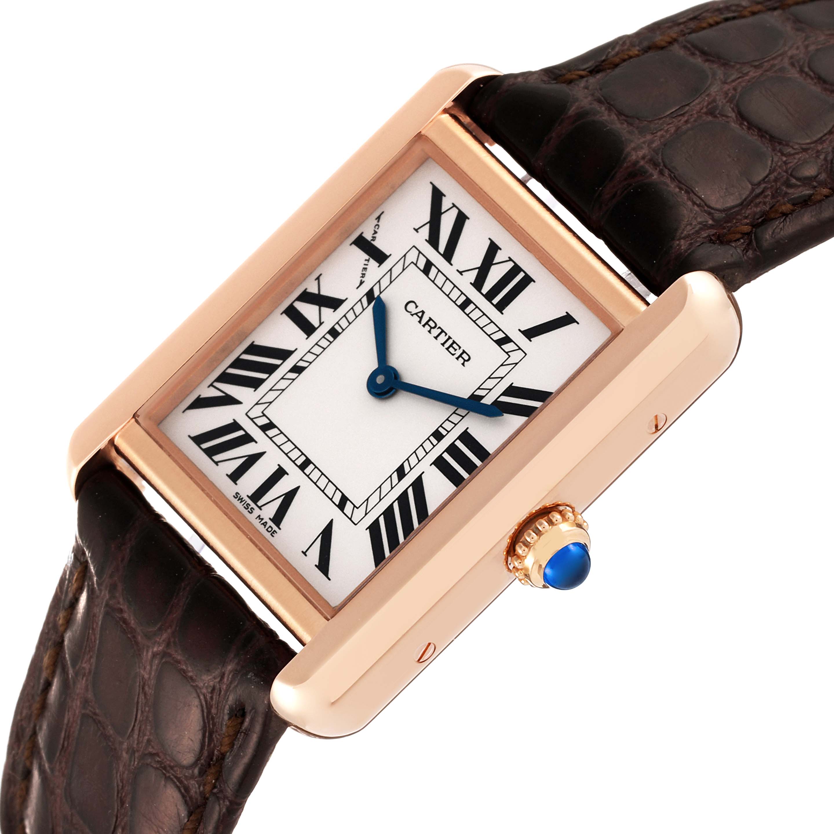 The image shows a Cartier Tank Solo W5200024 Women's Rose Gold Silver Dial W5200024 Women's Rose Gold Silver Dial watch featuring a rectangular case, Roman numeral dial, leather strap, and blue sapphire crown.