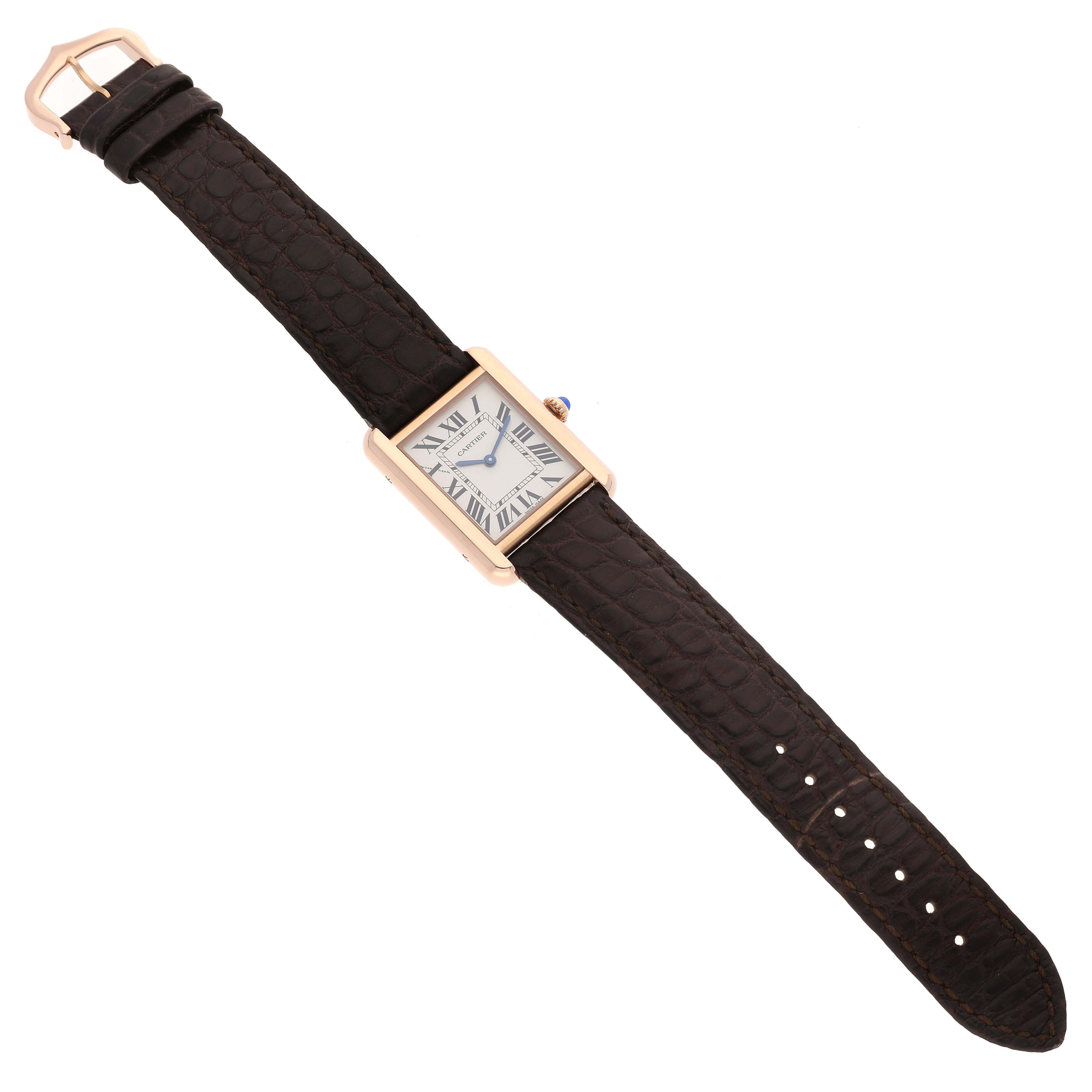 The Cartier Tank Solo W5200024 Women's Rose Gold Silver Dial W5200024 Women's Rose Gold Silver Dial watch is shown from a top-down angle, clearly displaying its rectangular face and leather strap.