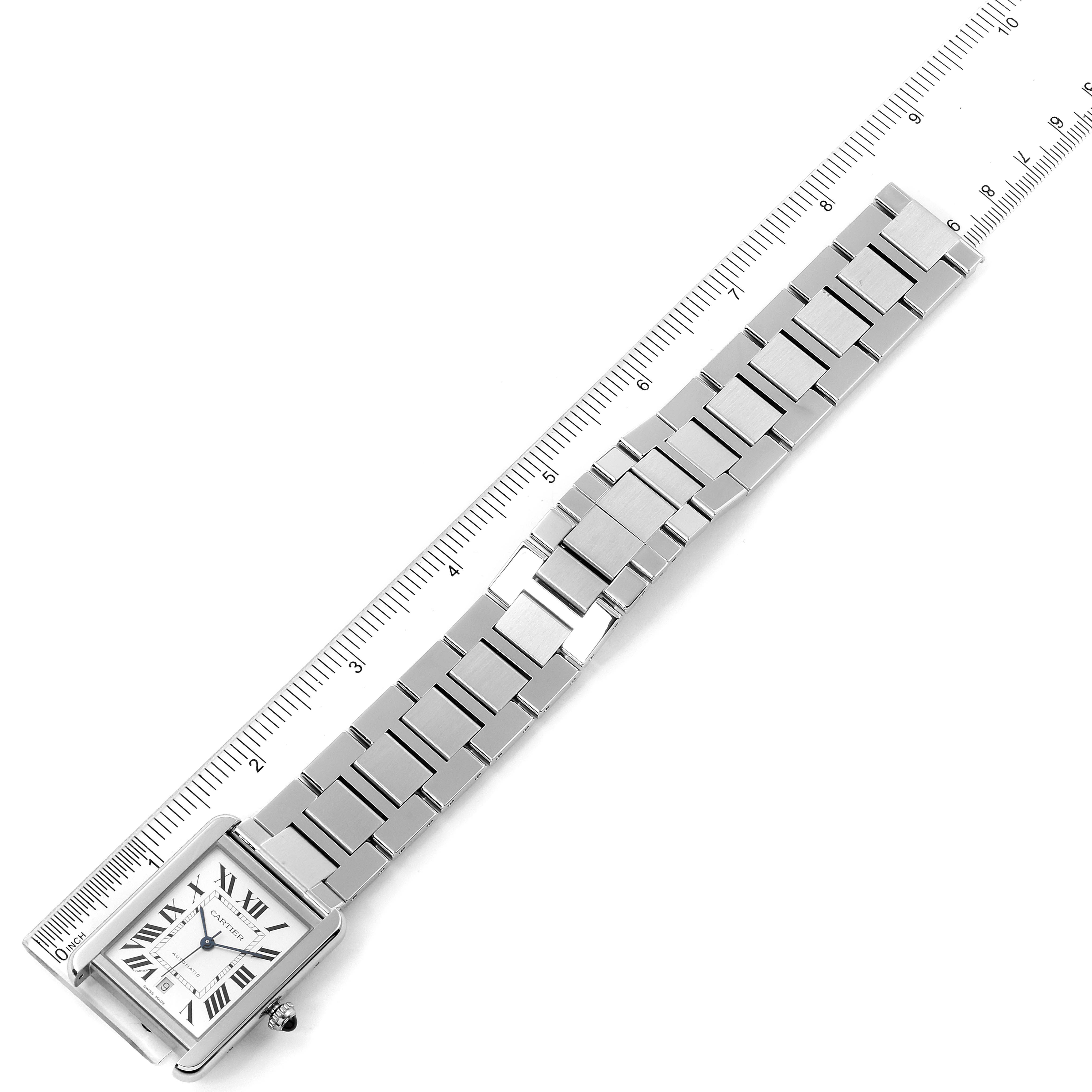 The image shows a Cartier Tank Solo W5200028 Men's Stainless Steel Silver Dial W5200028 Men's Stainless Steel Silver Dial watch laid flat with its bracelet stretched out alongside a ruler for scale.