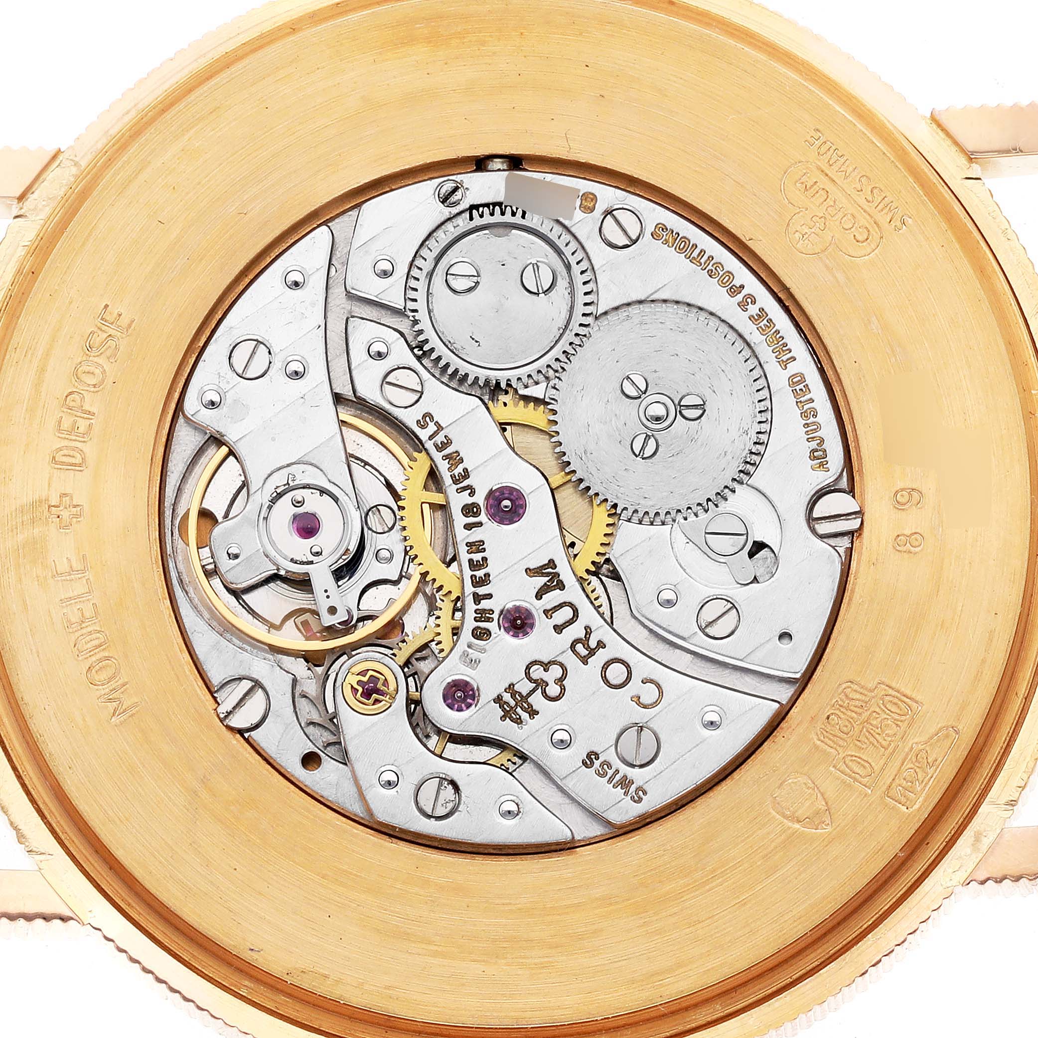 This image shows the back of the Corum Coin Watch 4414556 Men's Yellow Gold Champagne Dial 4414556 Men's Yellow Gold Champagne Dial, highlighting its intricate movement and mechanical parts.
