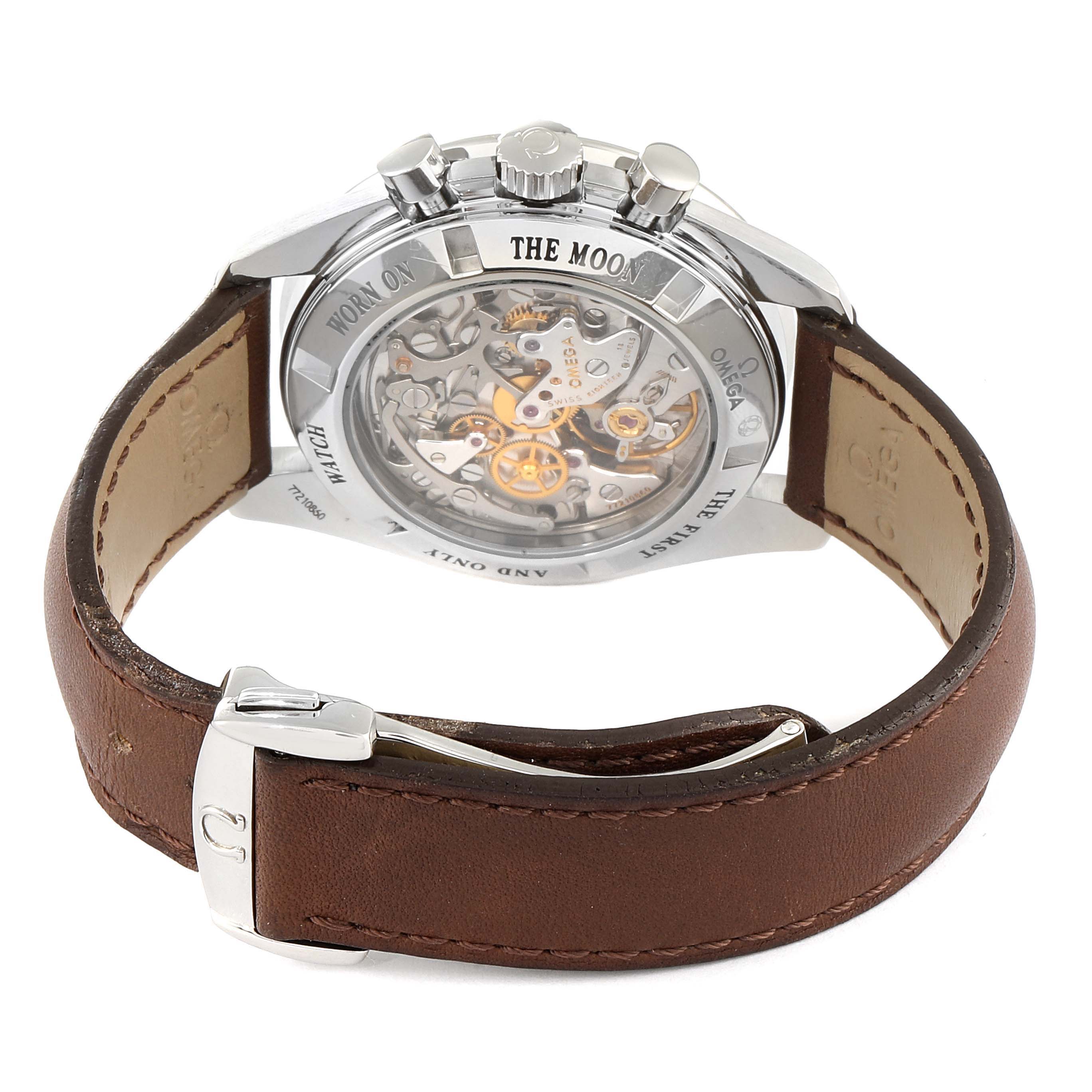 The image shows a rear view of the Omega Speedmaster 311.30.42.30.13.001 Men's Stainless Steel Brown Dial 311.30.42.30.13.001 Men's Stainless Steel Brown Dial watch, highlighting its mechanical movement and brown leather strap.