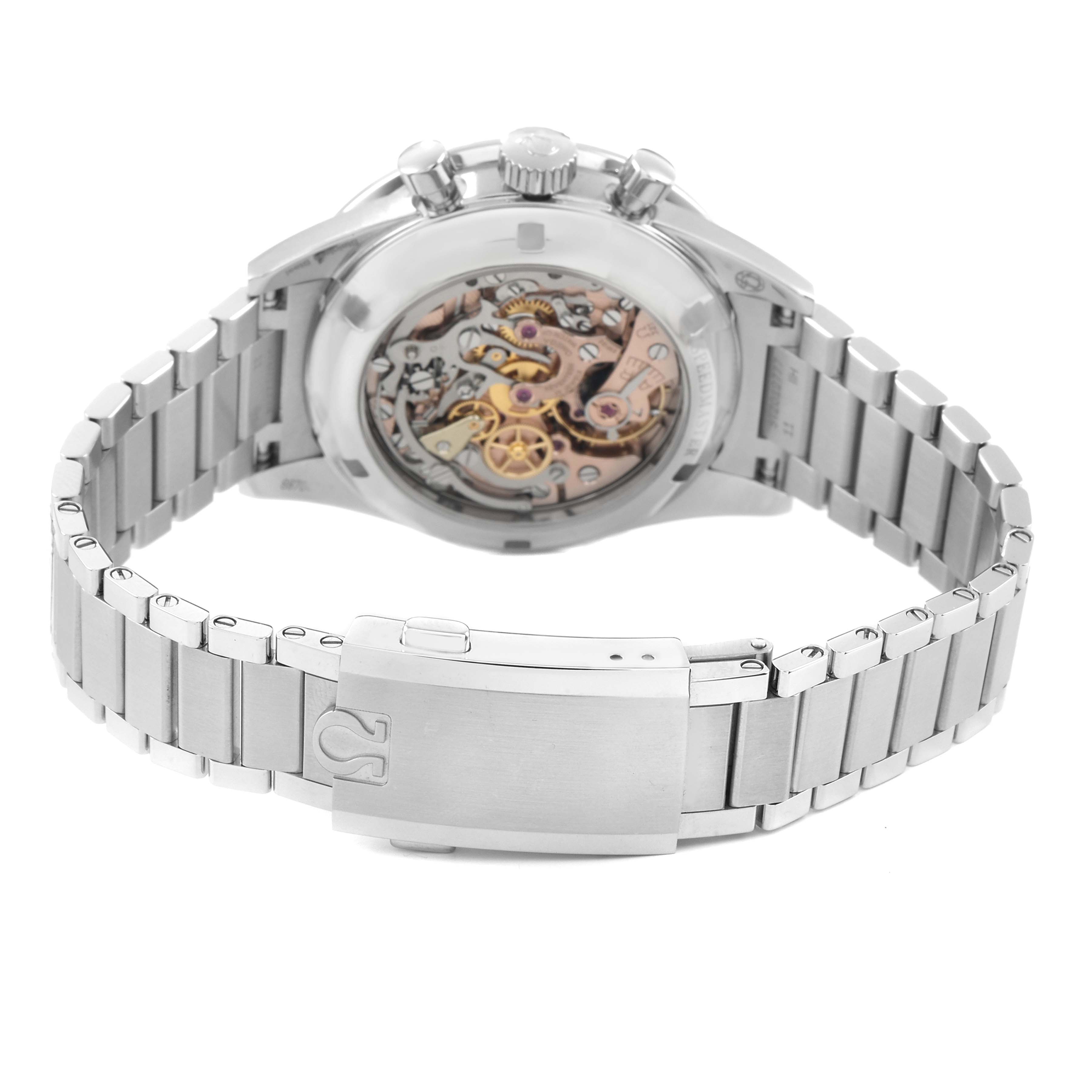 The image shows the Omega Speedmaster 311.30.40.30.01.001 Men's Stainless Steel Black Dial watch from the back, displaying its transparent case back and bracelet clasp.