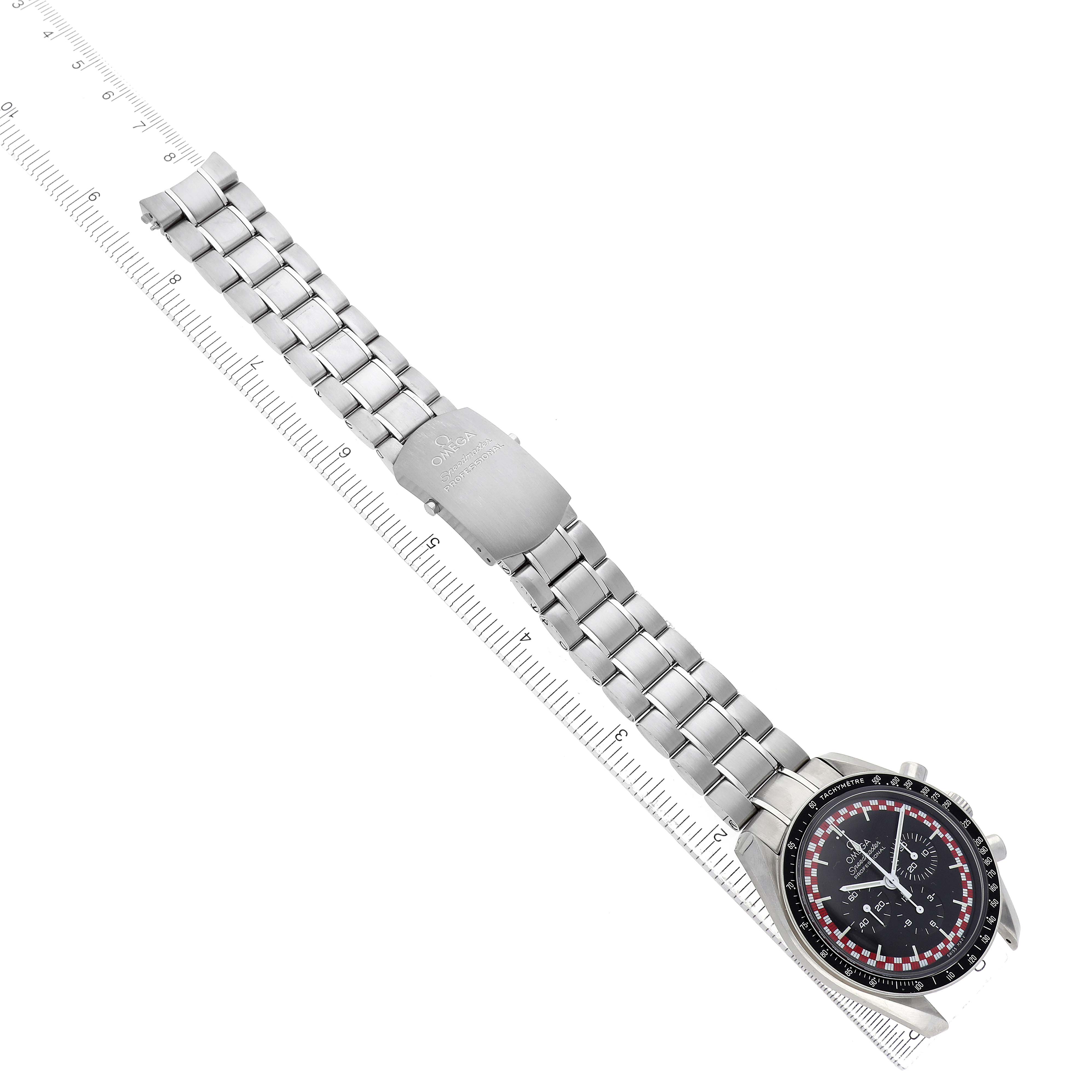 The Omega Speedmaster 311.30.42.30.01.004 Men's Stainless Steel Black Dial watch is shown at an angle highlighting the bracelet and clasp, with a ruler measuring its length.