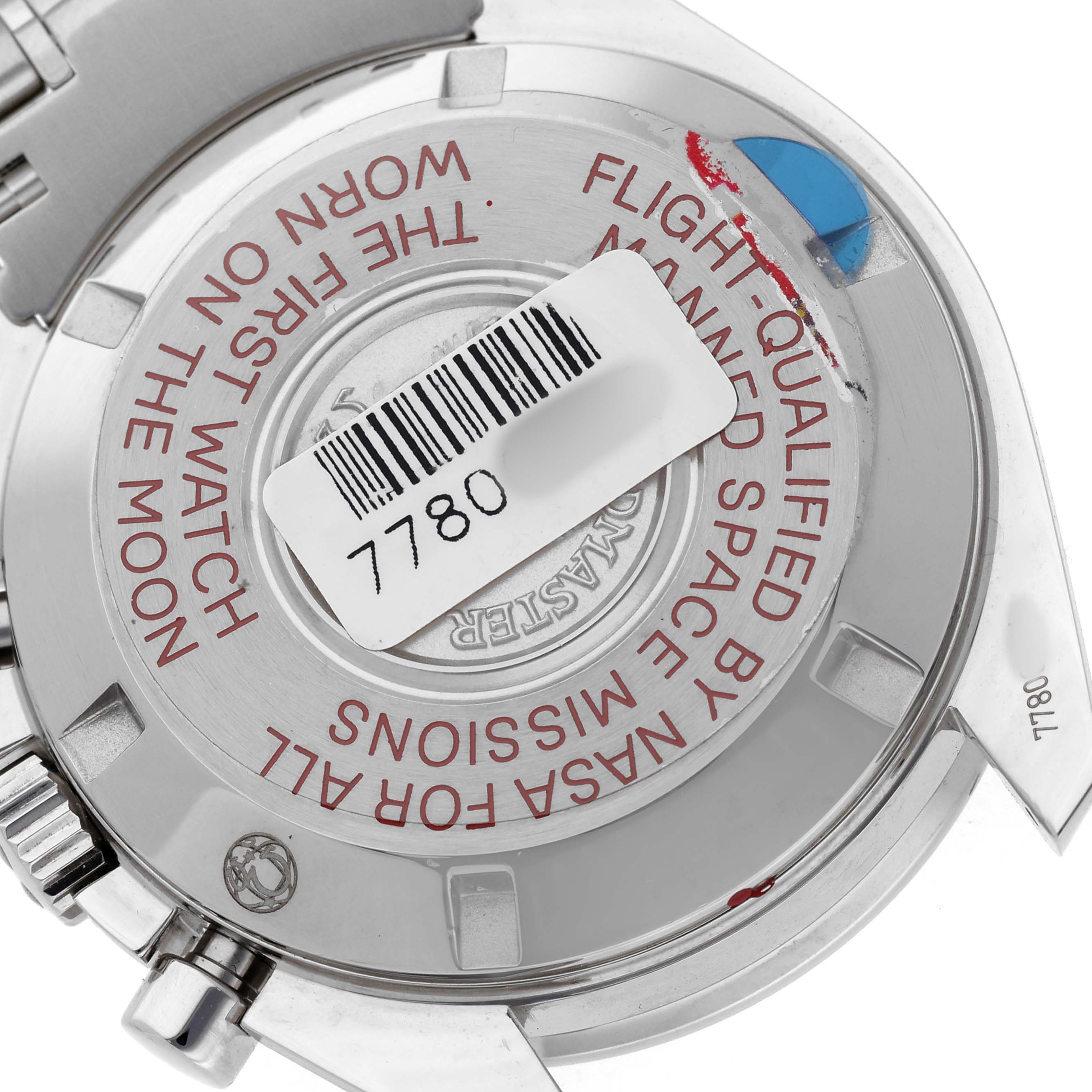 The image shows the back of an Omega Speedmaster 311.30.42.30.01.004 Men's Stainless Steel Black Dial watch, highlighting its engraved case back and partial bracelet.