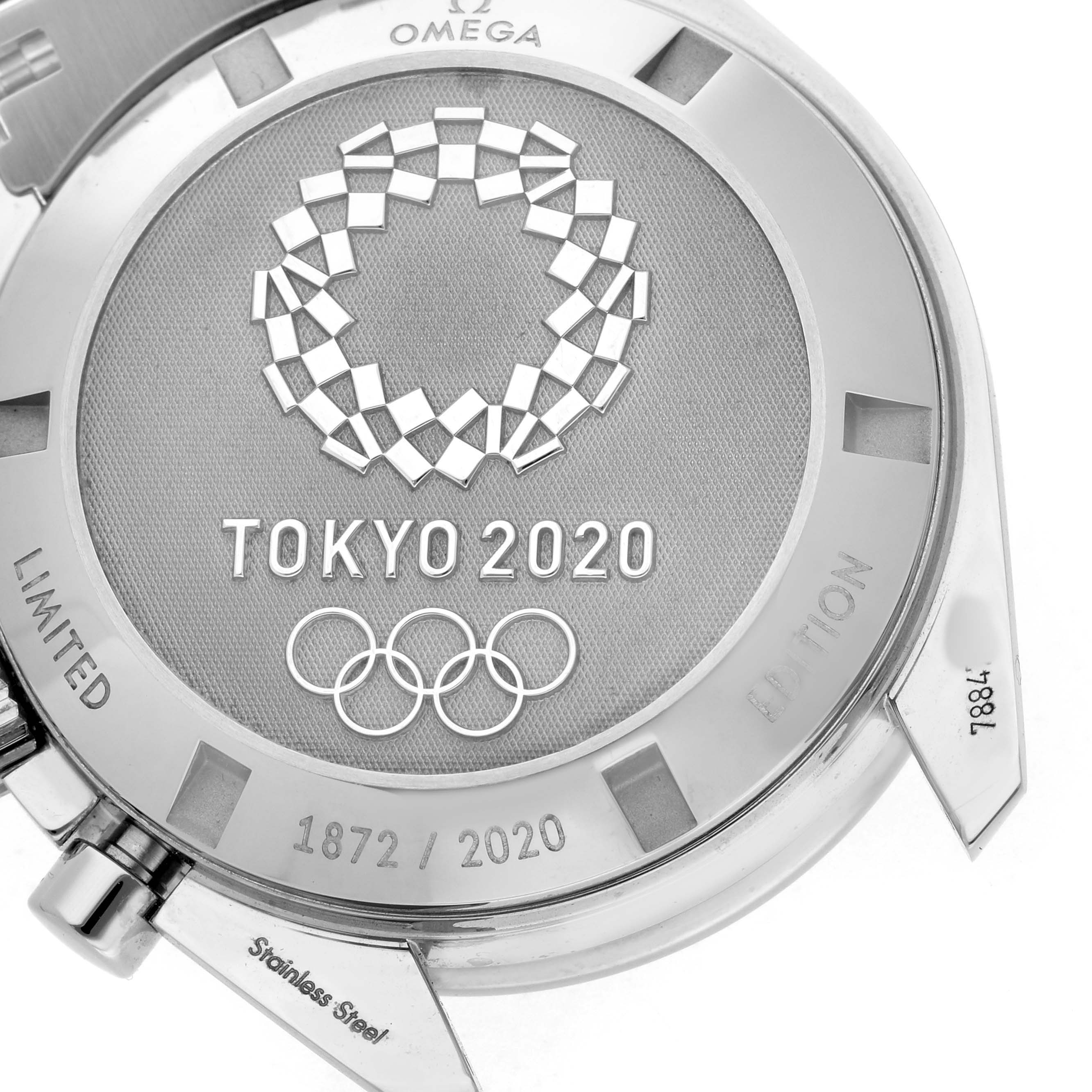 The image shows the back of the Omega Speedmaster 522.30.42.30.04.001 Men's Stainless Steel White Dial watch, featuring a "Tokyo 2020" Olympic design.