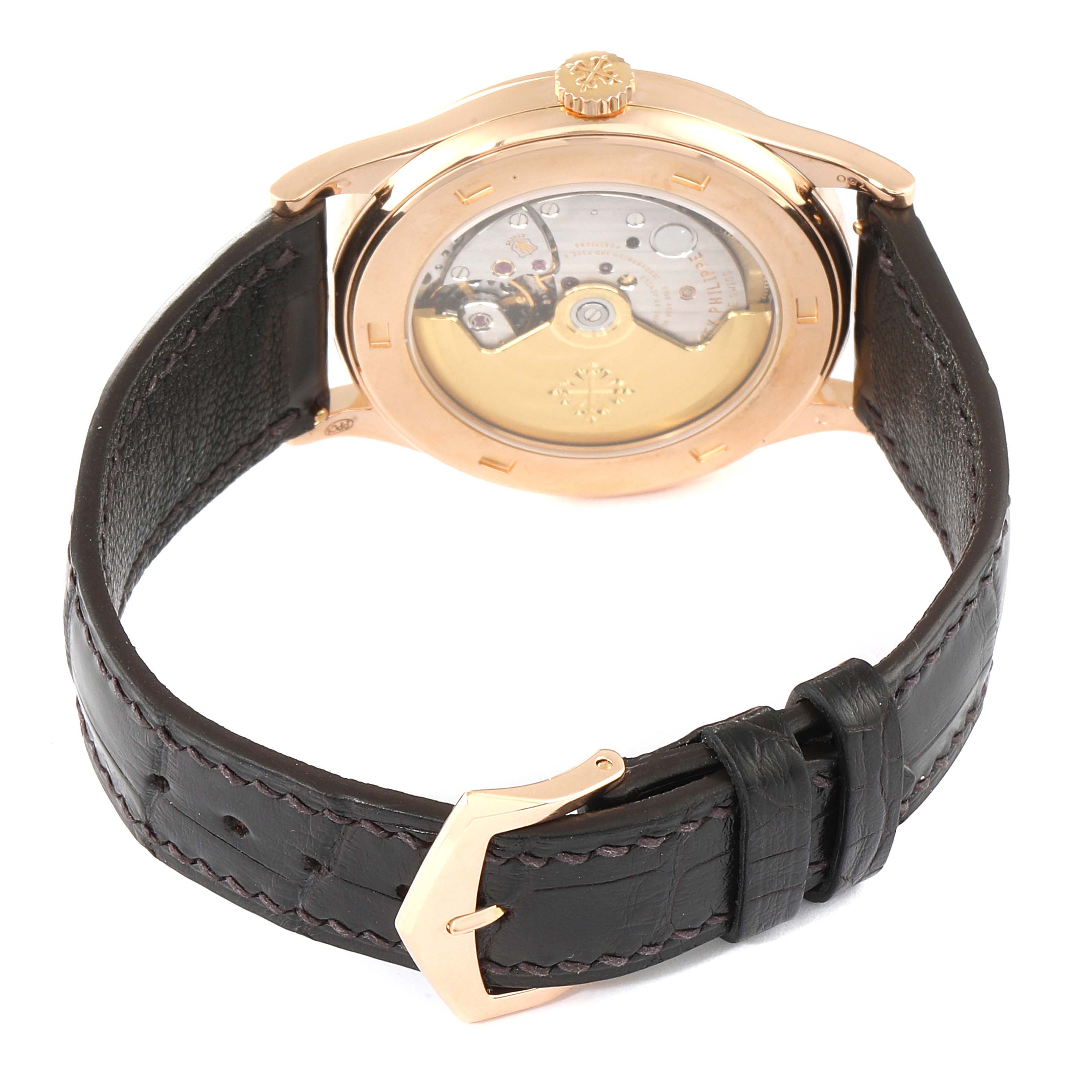 The image shows the back view of a Patek Philippe Calatrava 5296R-001 Men
s Rose Gold Silver Dial 5296R-001 Men
s Rose Gold Silver Dial watch, highlighting the movement and leather strap.