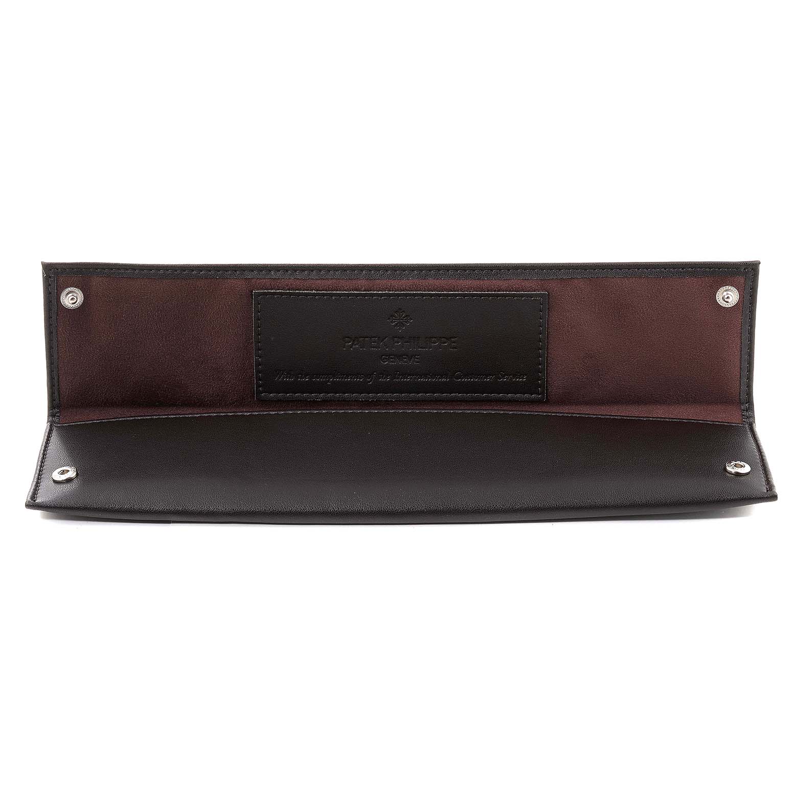 This is a Patek Philippe Calatrava 5119G Men
s White Gold White Dial 5119G Men
s White Gold White Dial watch leather case photographed open, showing its interior and brand label.