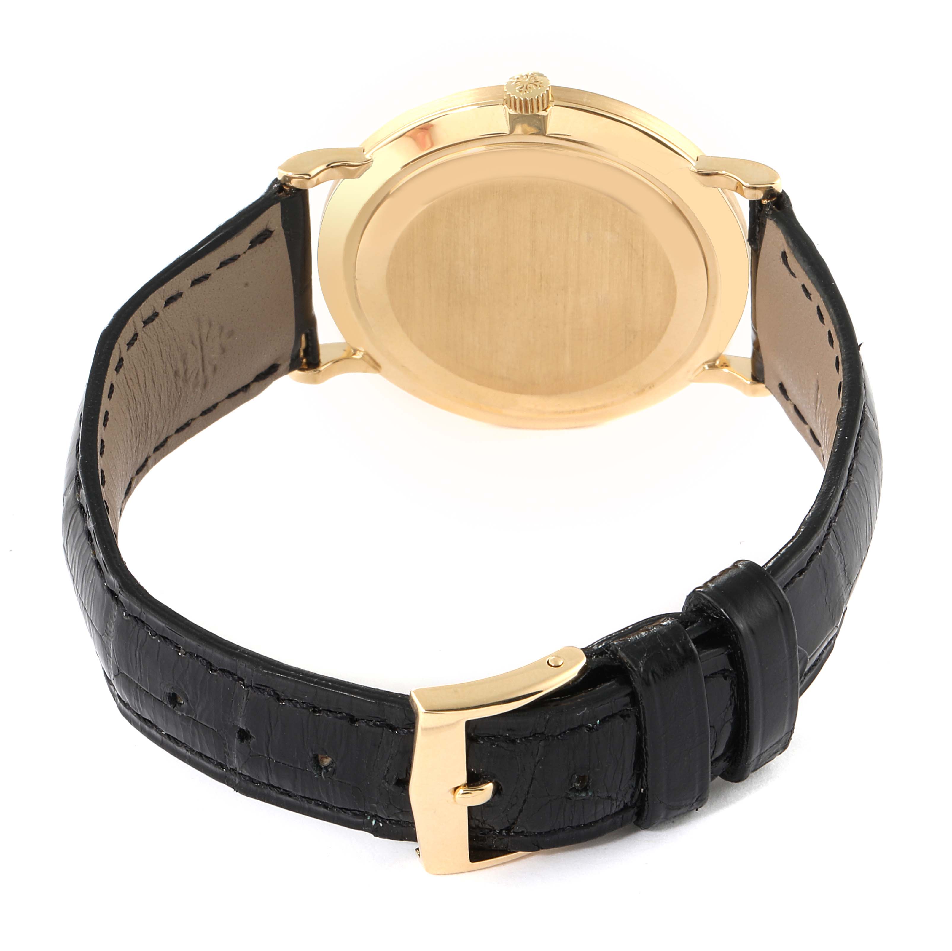 This image shows the back case and strap of a Patek Philippe Calatrava 3919 Men's Yellow Gold White Dial 3919 Men's Yellow Gold White Dial watch.