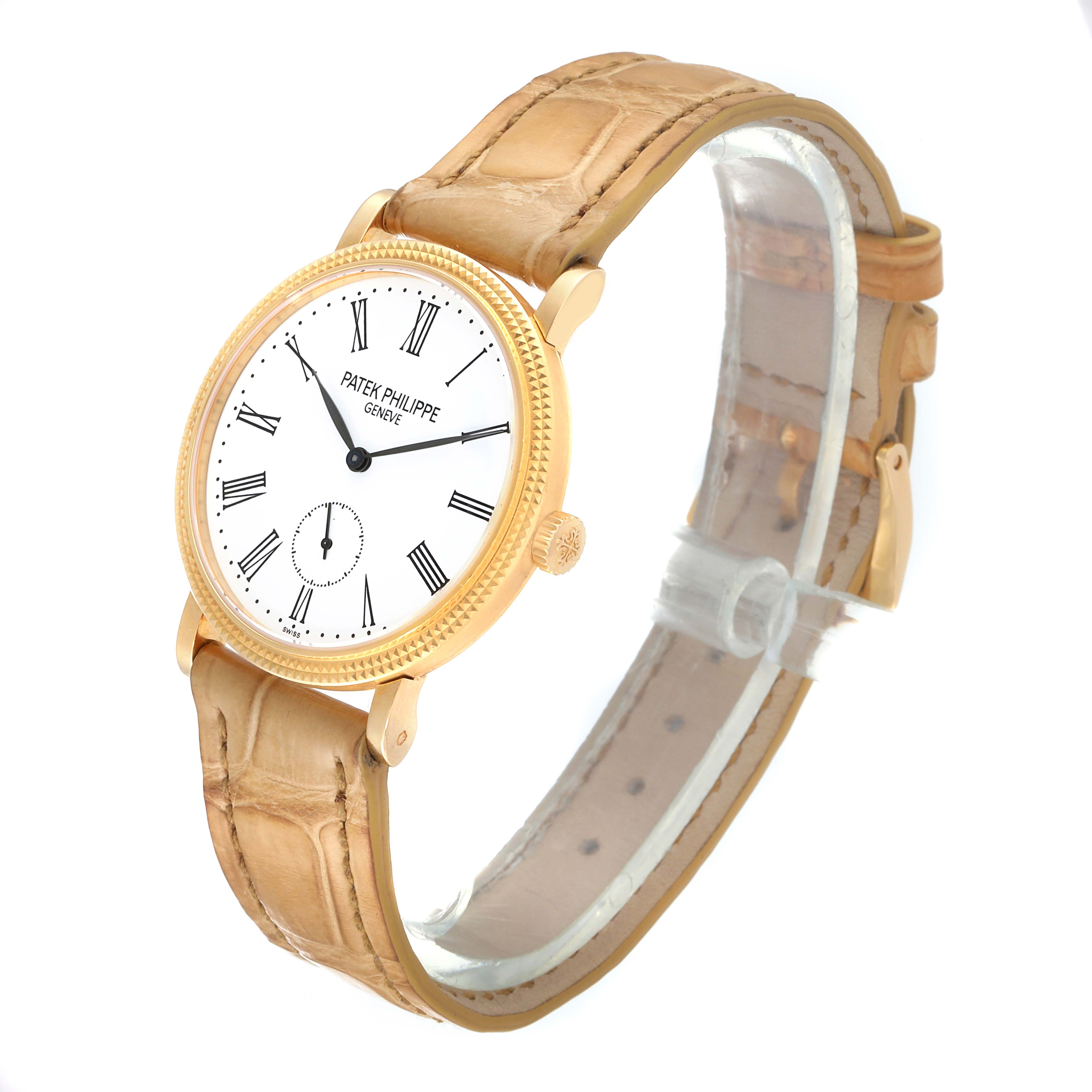 The image shows a Patek Philippe Calatrava 7119J Women's Yellow Gold White Dial 7119J Women's Yellow Gold White Dial watch at a three-quarter angle, highlighting its face, bezel, crown, and strap.