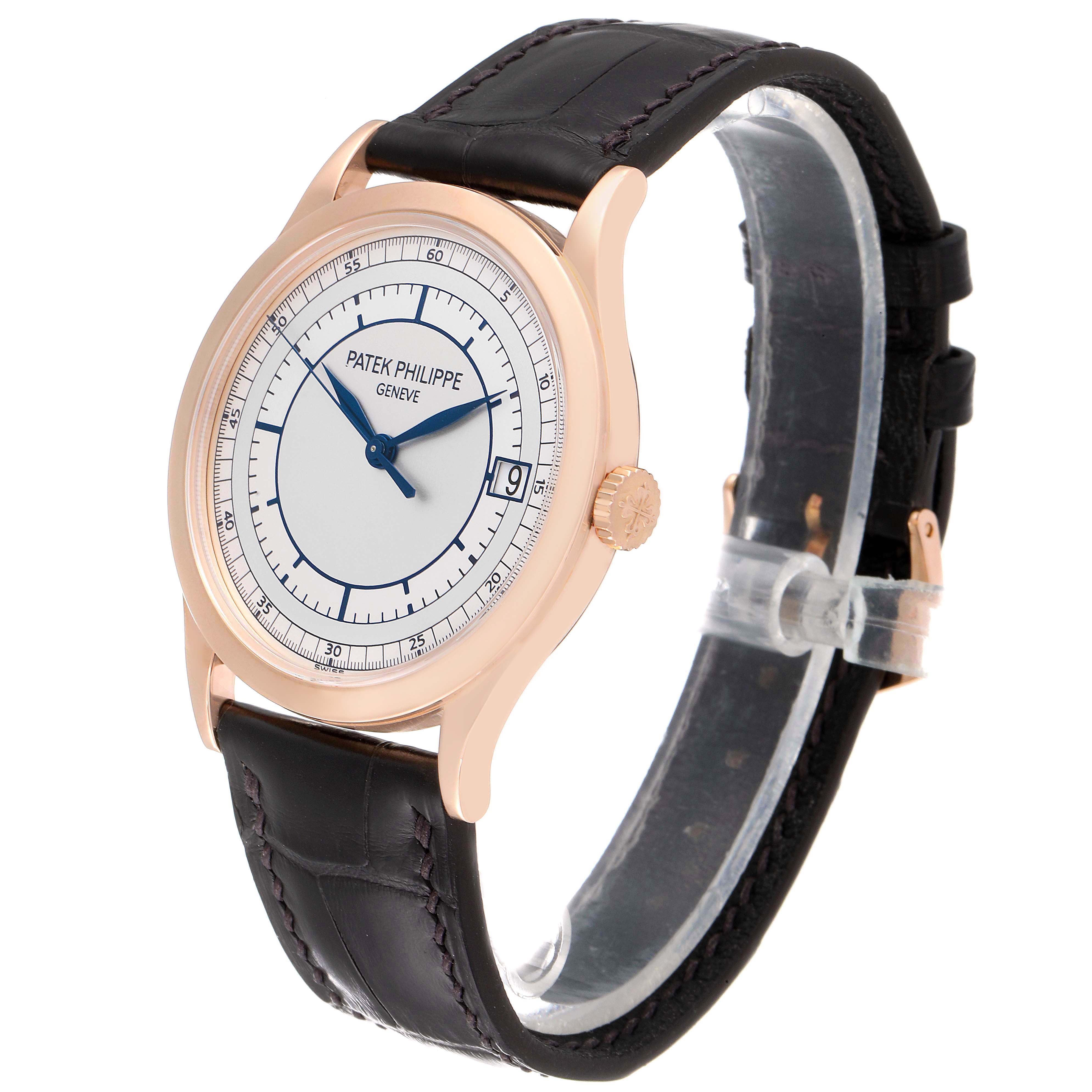The Patek Philippe Calatrava 5296R-001 Men
s Rose Gold Silver Dial 5296R-001 Men
s Rose Gold Silver Dial watch is shown at a front-side angle featuring its dial, case, crown, and leather strap.