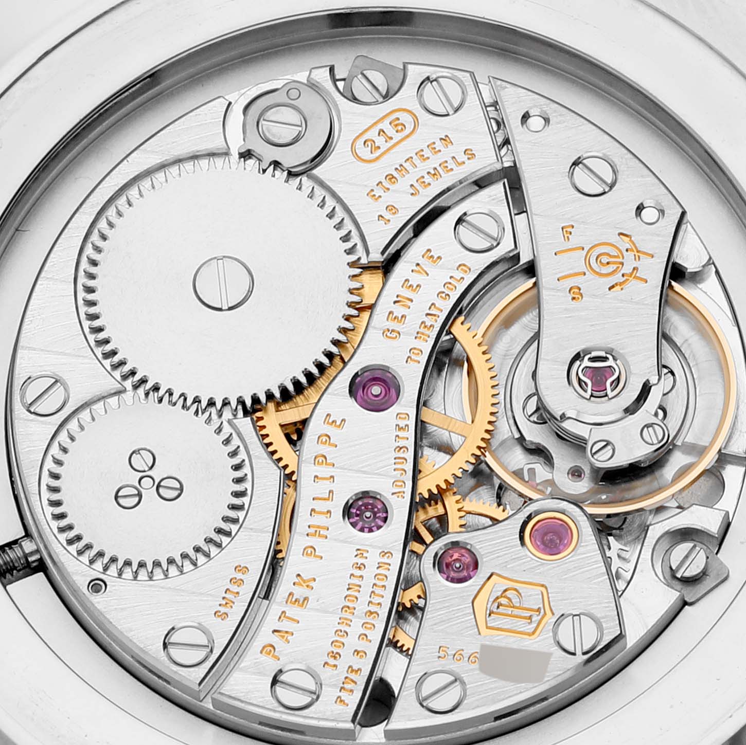 This image shows a close-up of the movement of a Patek Philippe Calatrava 5119G Men
s White Gold White Dial 5119G Men
s White Gold White Dial watch, displaying gears and intricate components.