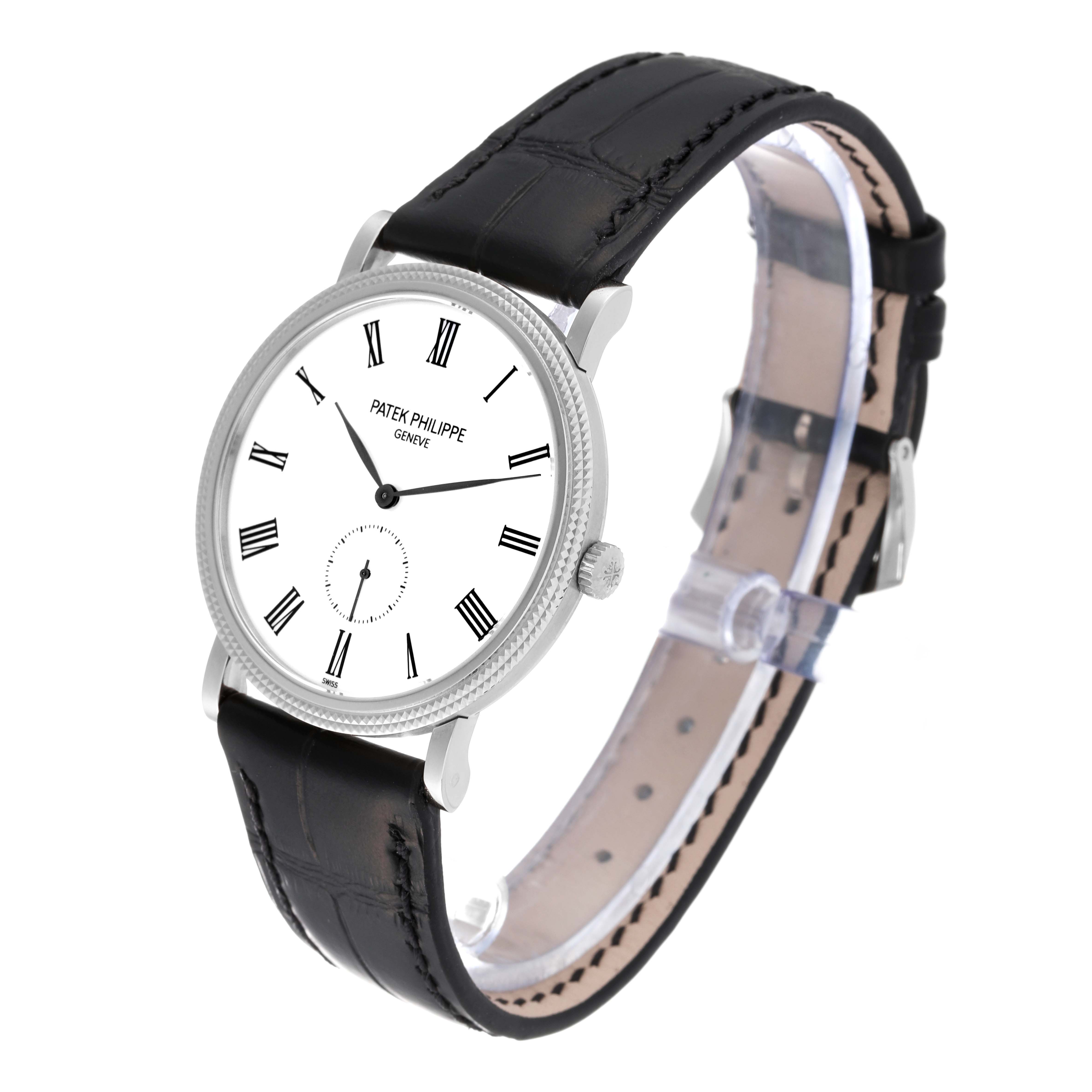 The Patek Philippe Calatrava 5119G Men
s White Gold White Dial 5119G Men
s White Gold White Dial watch is shown from a three-quarter angle, highlighting the dial, bezel, crown, and black leather strap.