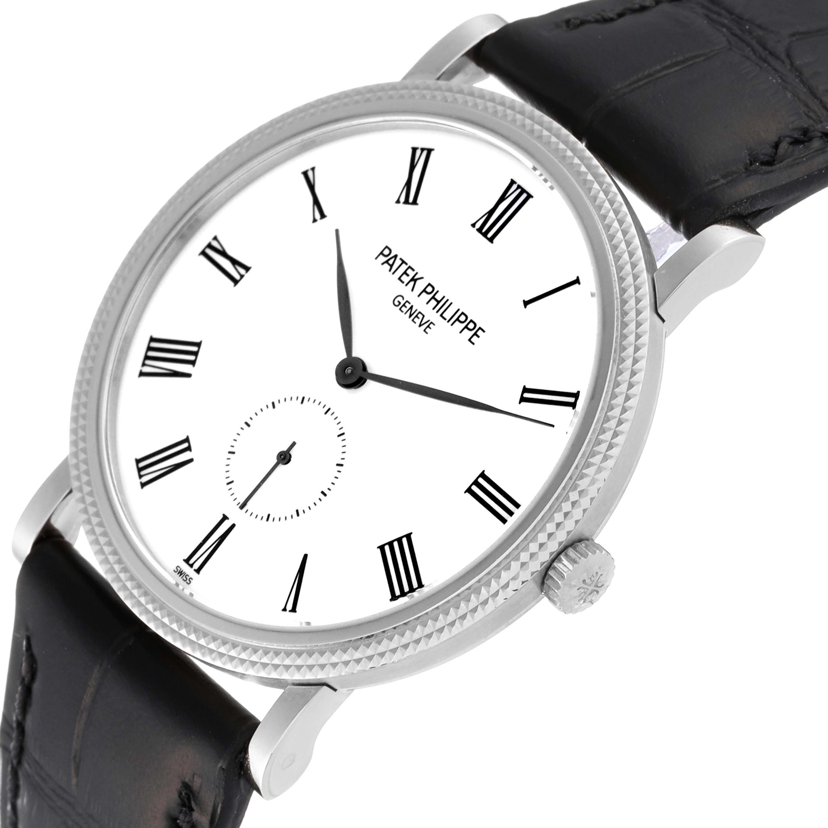 The image shows a Patek Philippe Calatrava 5119G Men
s White Gold White Dial 5119G Men
s White Gold White Dial watch at a slight angle, highlighting the face, crown, and black leather strap.