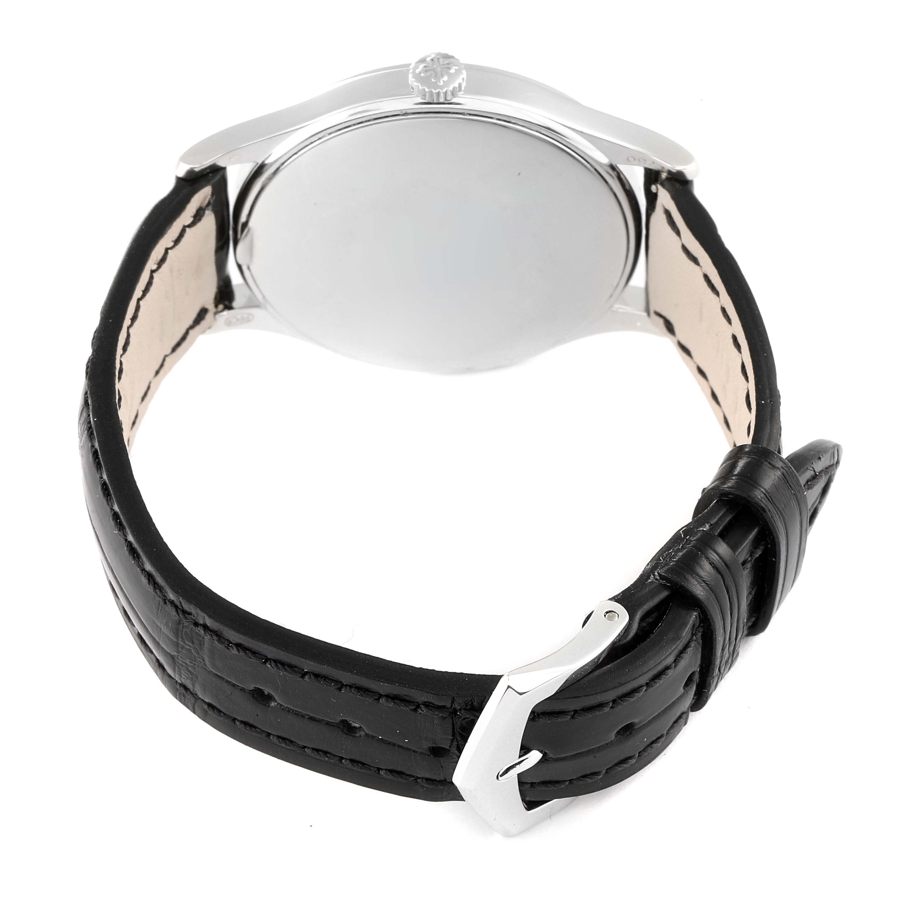 The image shows the back of a Patek Philippe Calatrava 4896G Women's White Gold Blue Dial 4896G Women's White Gold Blue Dial watch, highlighting the case back, black leather strap, and buckle.