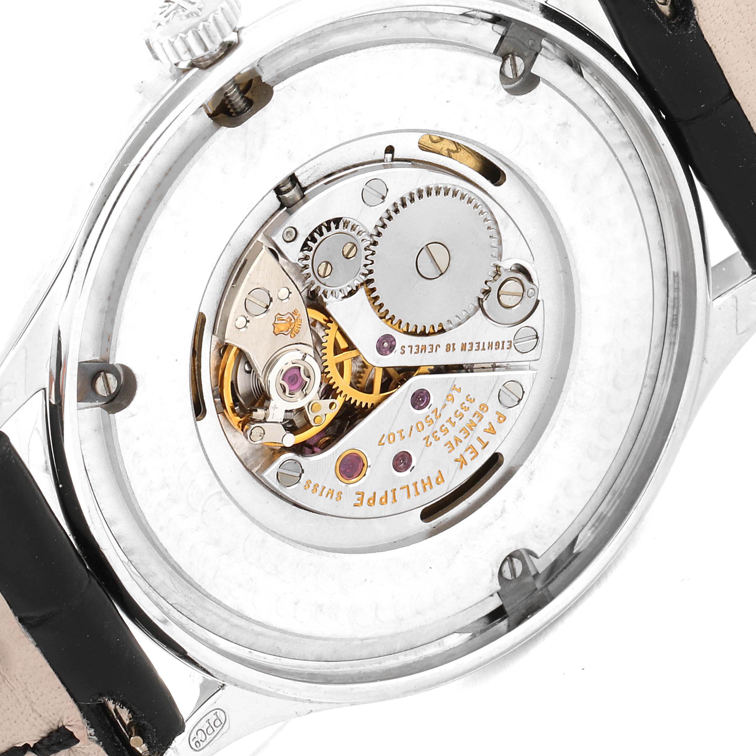 The image shows the back view of a Patek Philippe Calatrava 4896G Women's White Gold Blue Dial 4896G Women's White Gold Blue Dial watch, highlighting its movement and internal mechanisms.